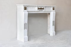 Antique mantel of carrara marble, gold plated ornaments, 19th century, Louis XVI