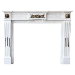 Antique mantel of carrara marble, gold plated ornaments, 19th century, Louis XVI