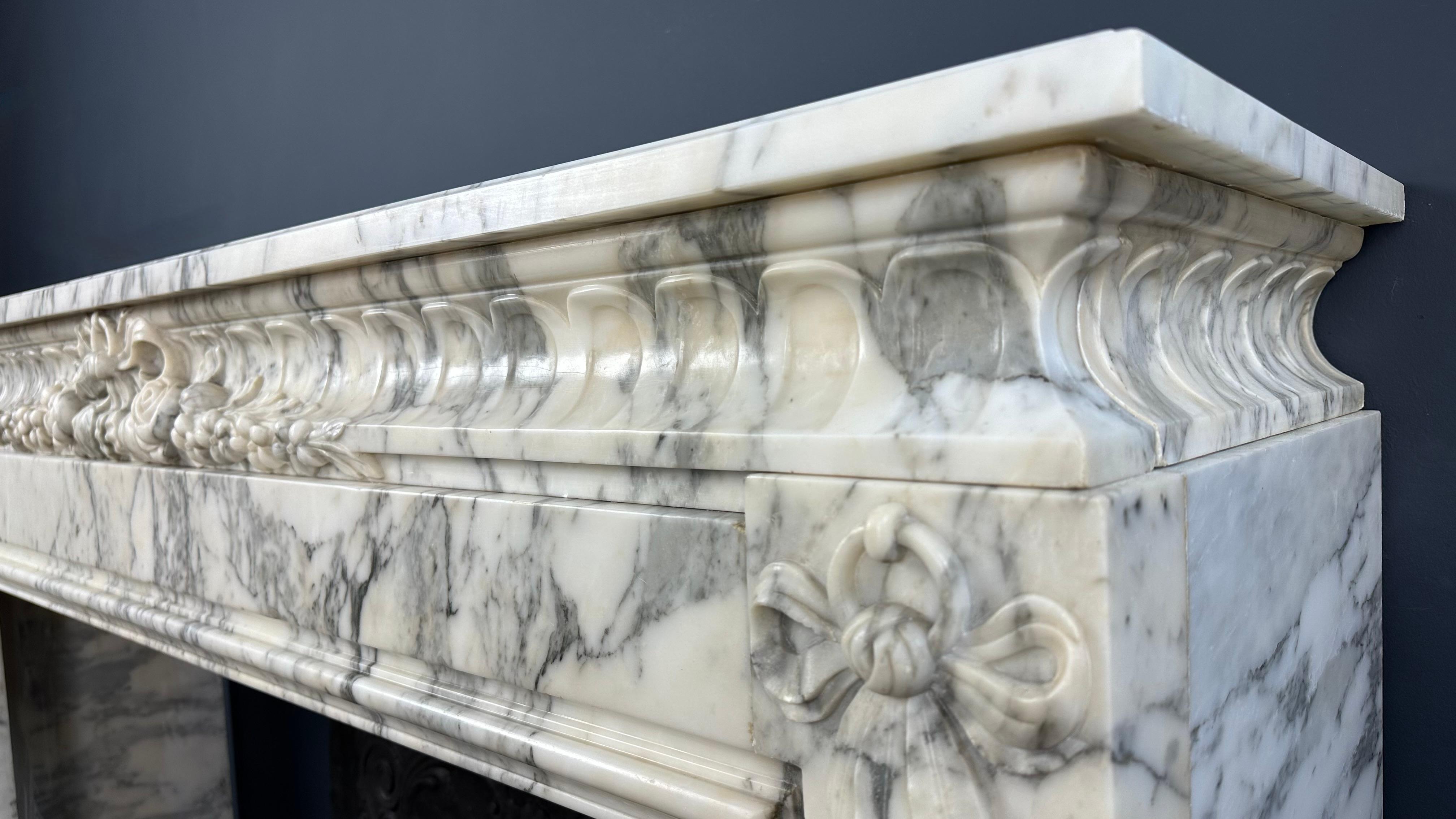Hand-Carved Antique Mantel: Refined Elegance and Craftsmanship in Perfect Harmony For Sale