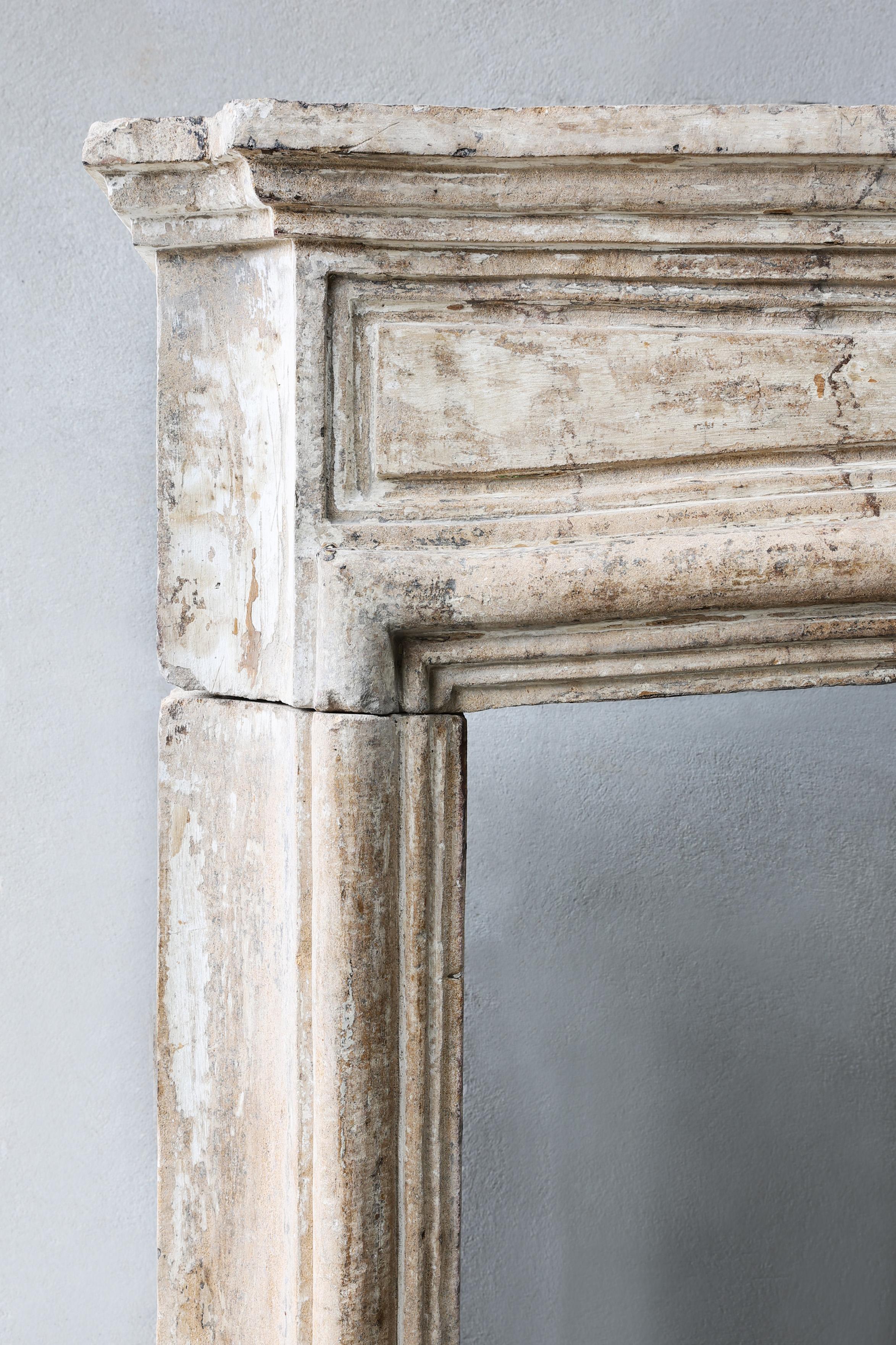 Antique mantel surround of French limestone, Louis XIV, 19th century For Sale 4