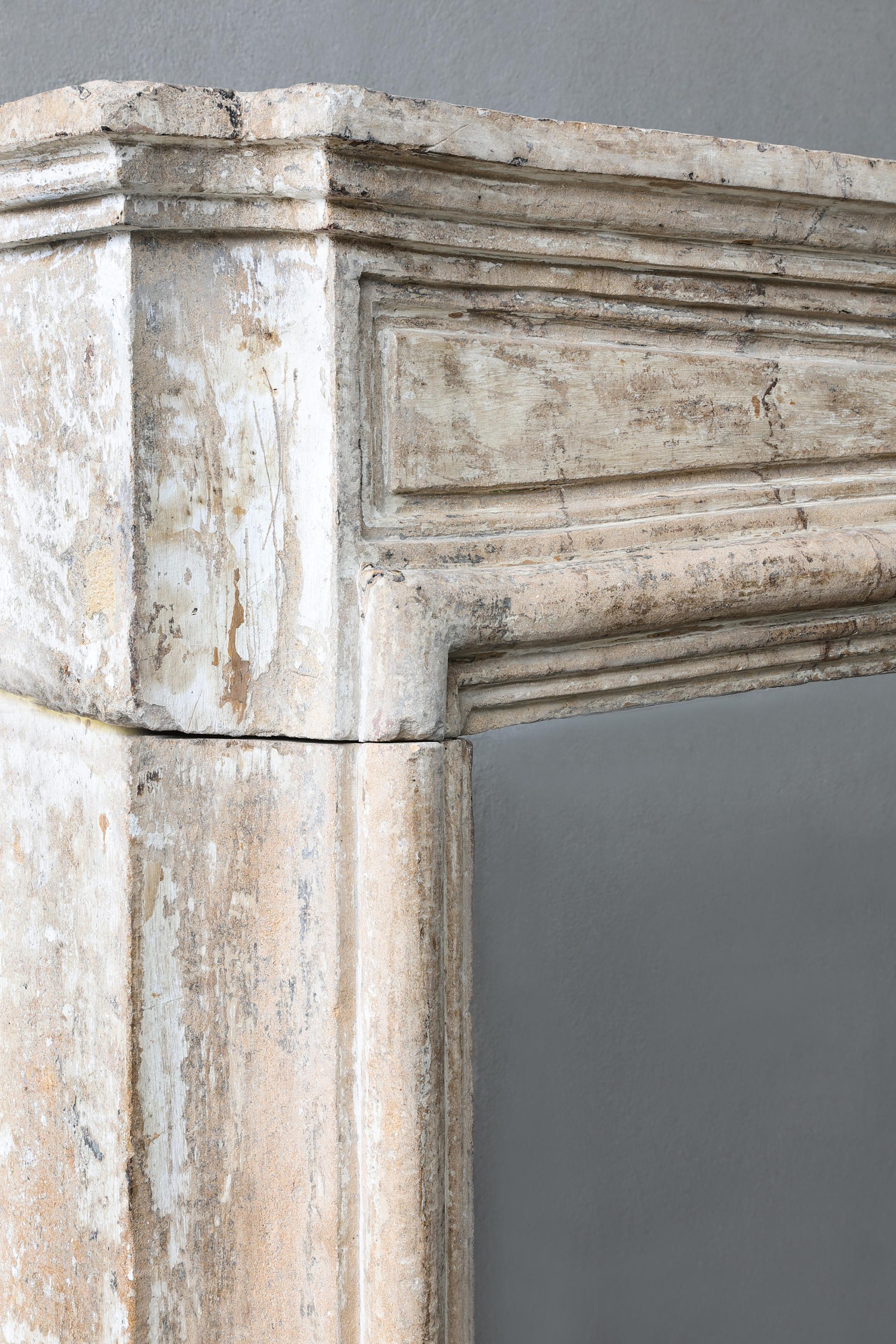 Antique mantel surround of French limestone, Louis XIV, 19th century For Sale 6