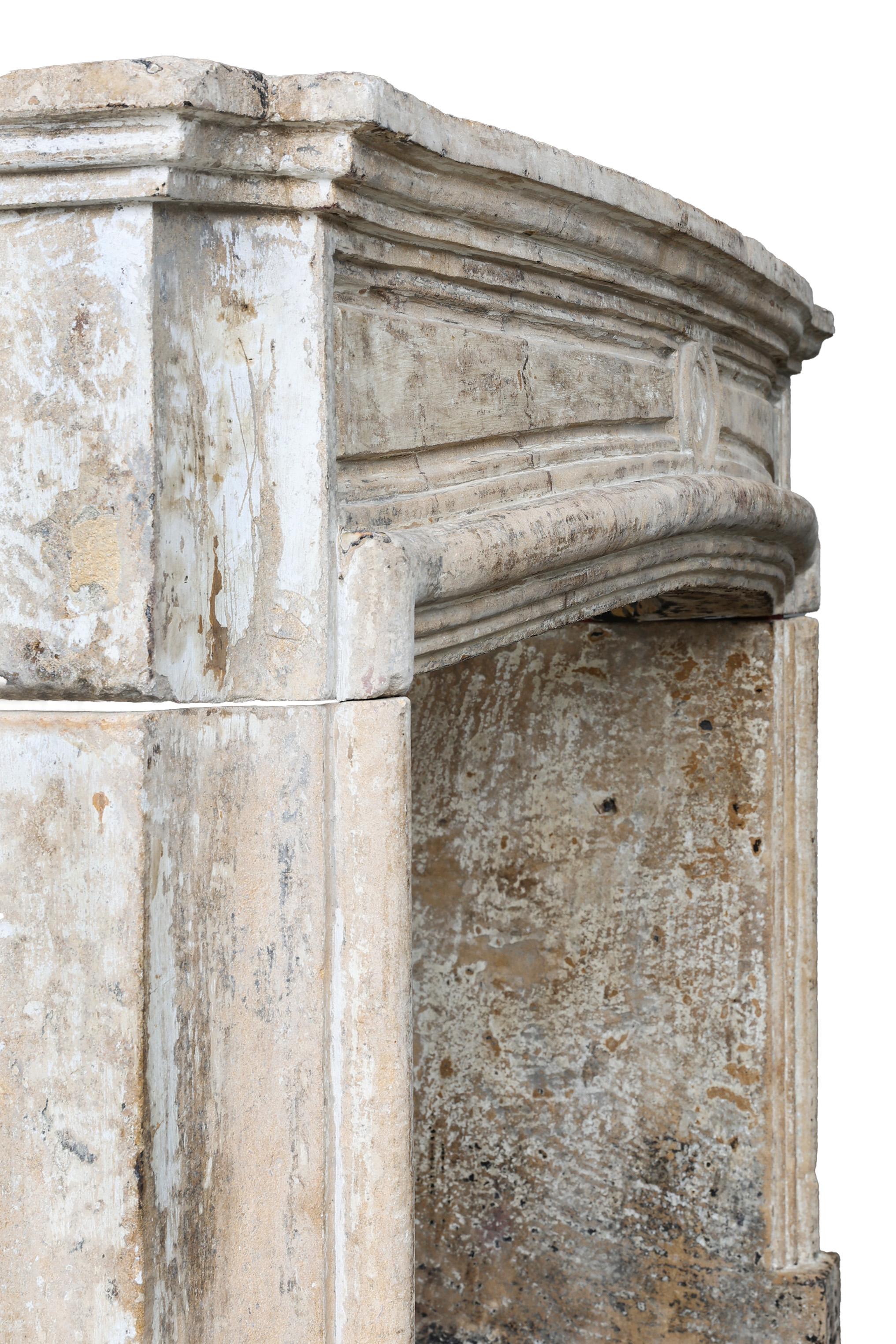 Antique mantel surround of French limestone, Louis XIV, 19th century For Sale 7