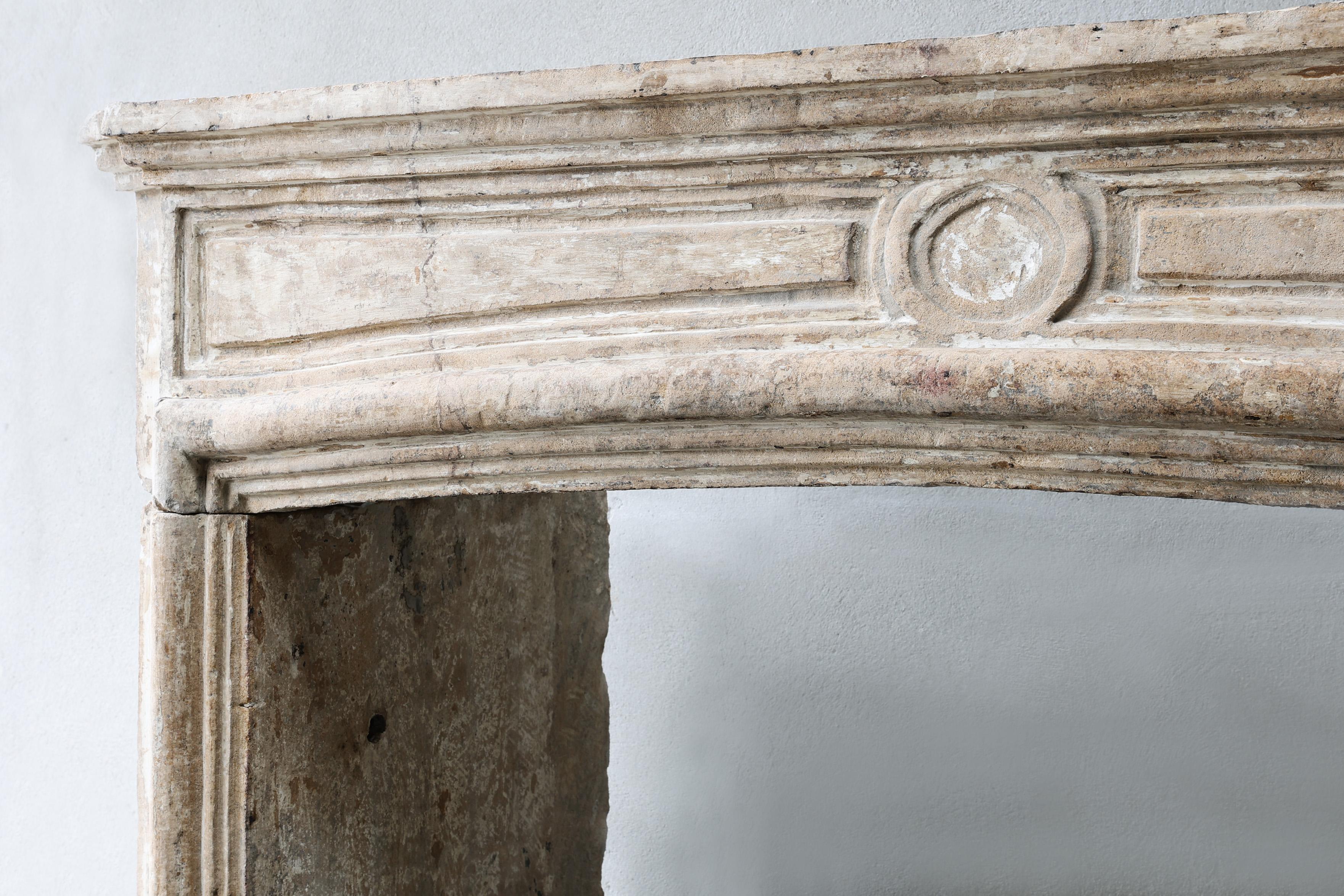 Limestone Antique mantel surround of French limestone, Louis XIV, 19th century For Sale