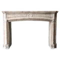Antique mantel surround of French limestone, Louis XIV, 19th century