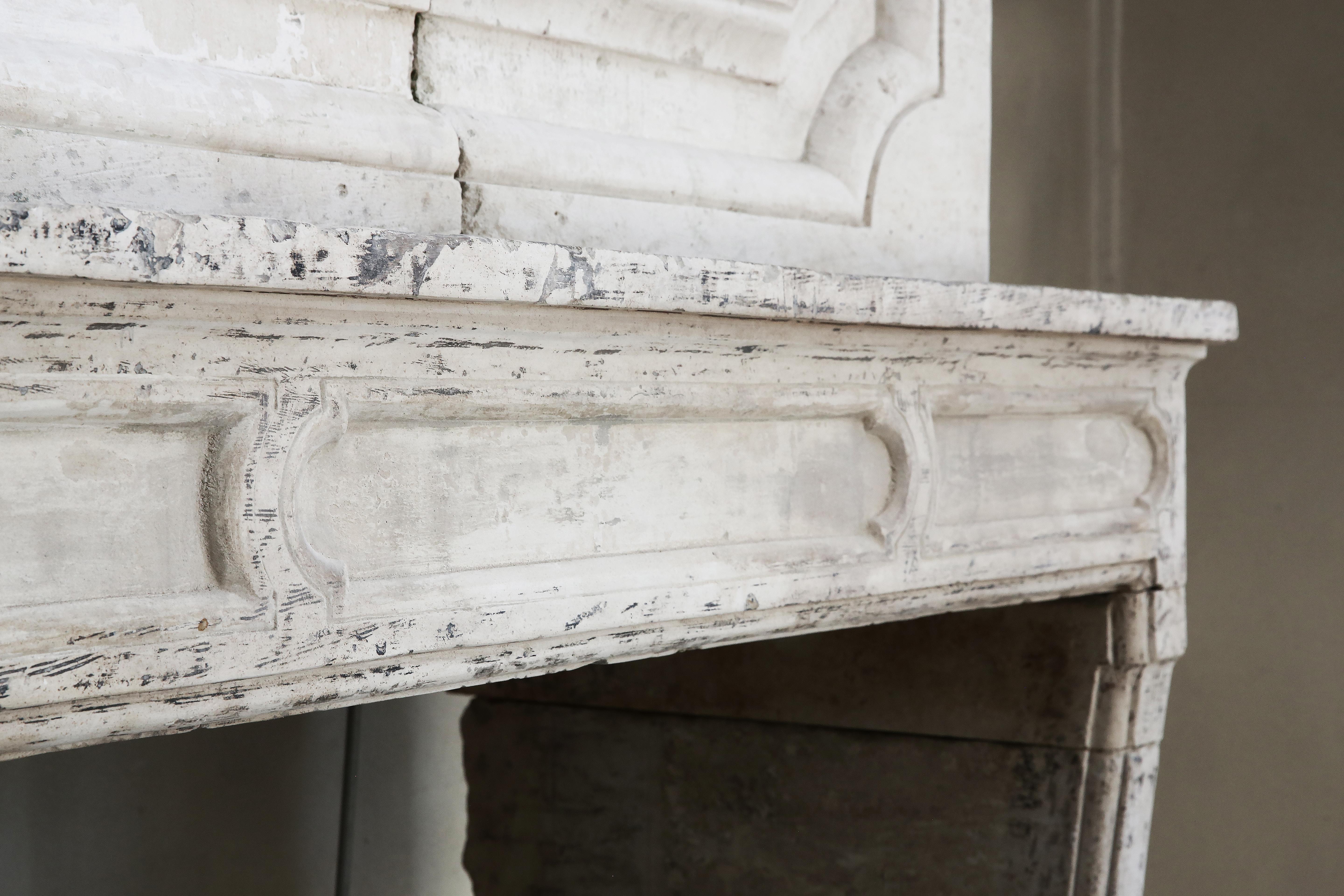 18th Century and Earlier 18th Century Mantel Surround of French Limestone with a Trumeau
