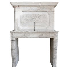 18th Century Mantel Surround of French Limestone with a Trumeau