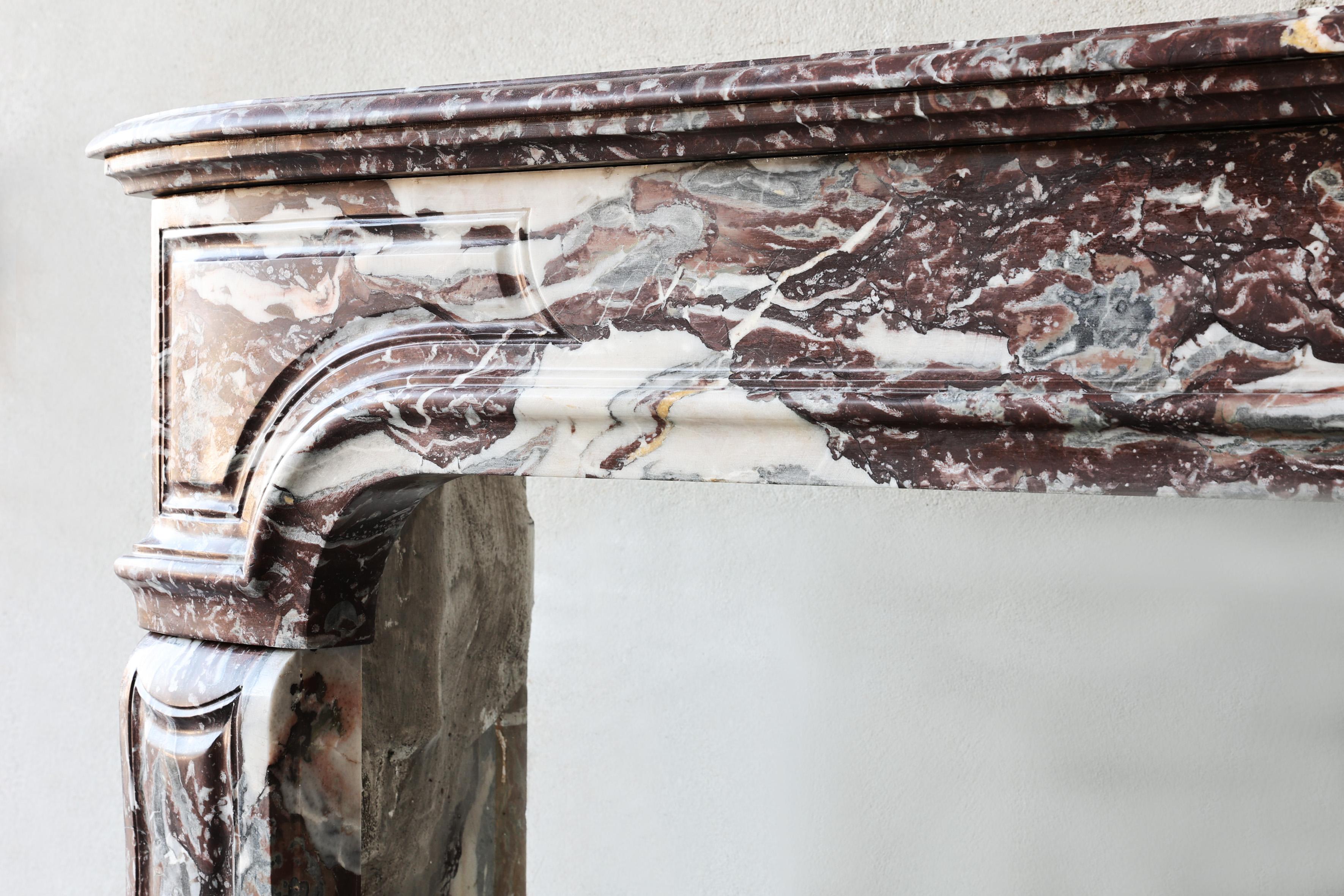 French Antique mantel surround of Griotte de Campan rouge marble, style Louis XIV