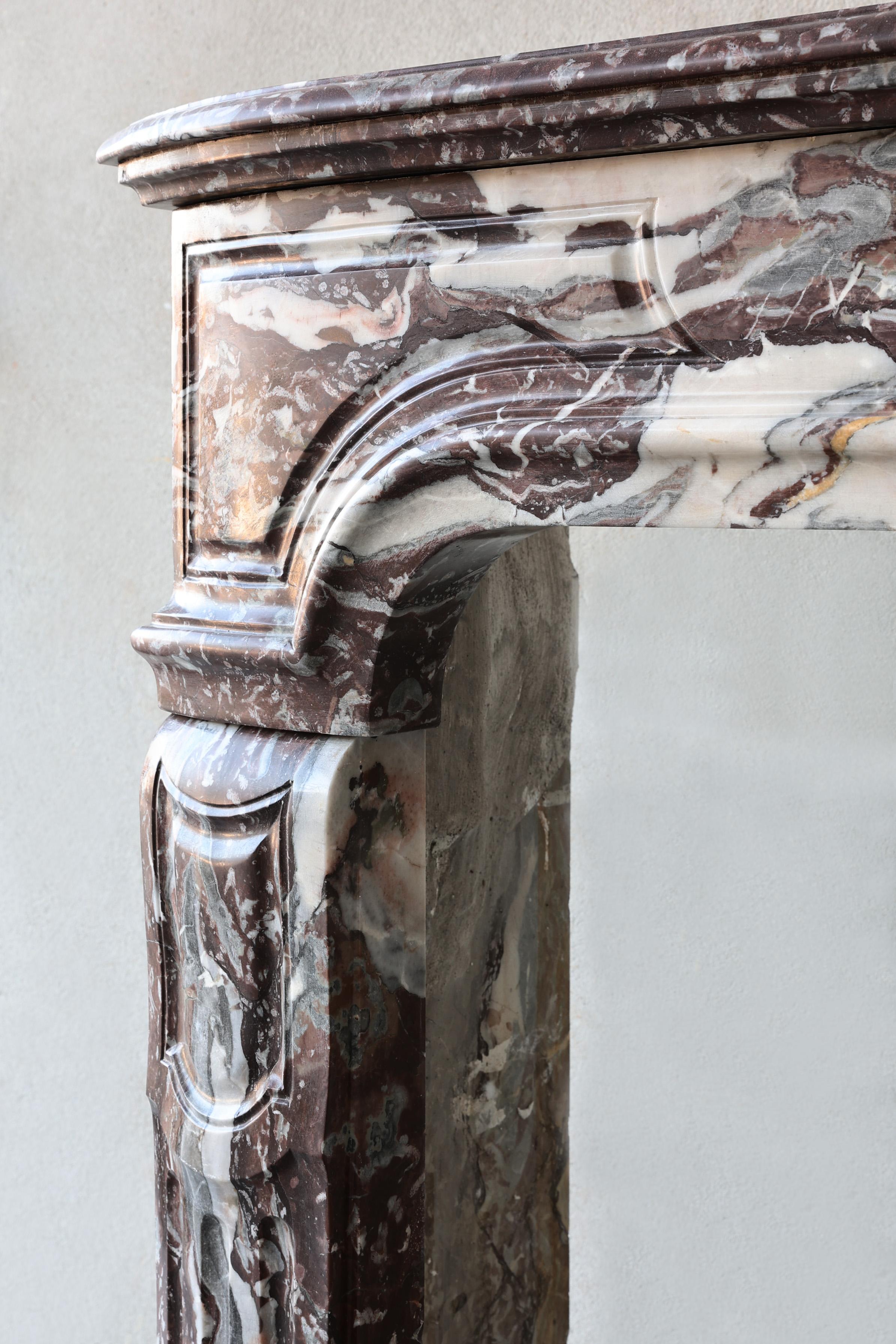 Antique mantel surround of Griotte de Campan rouge marble, style Louis XIV 1