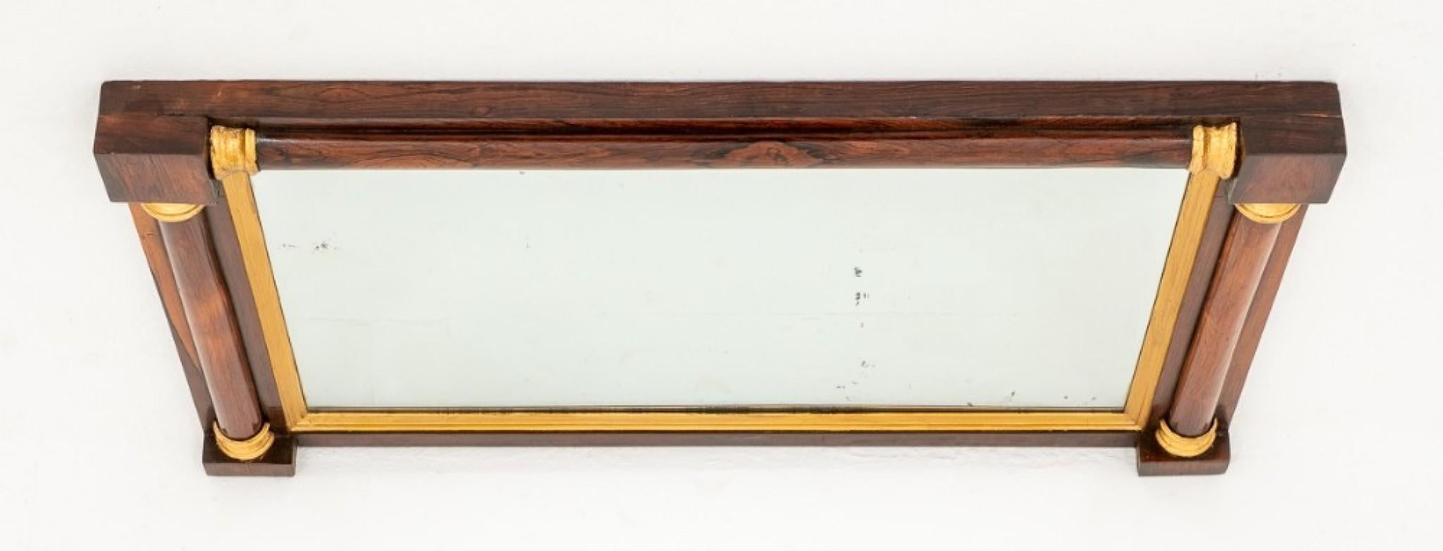 Rosewood, Faux Rosewood and Gilt Mirror.
Having turned uprights and gilt collars.
19th century
The mirror plate (having some foxing) features gilt mouldings.