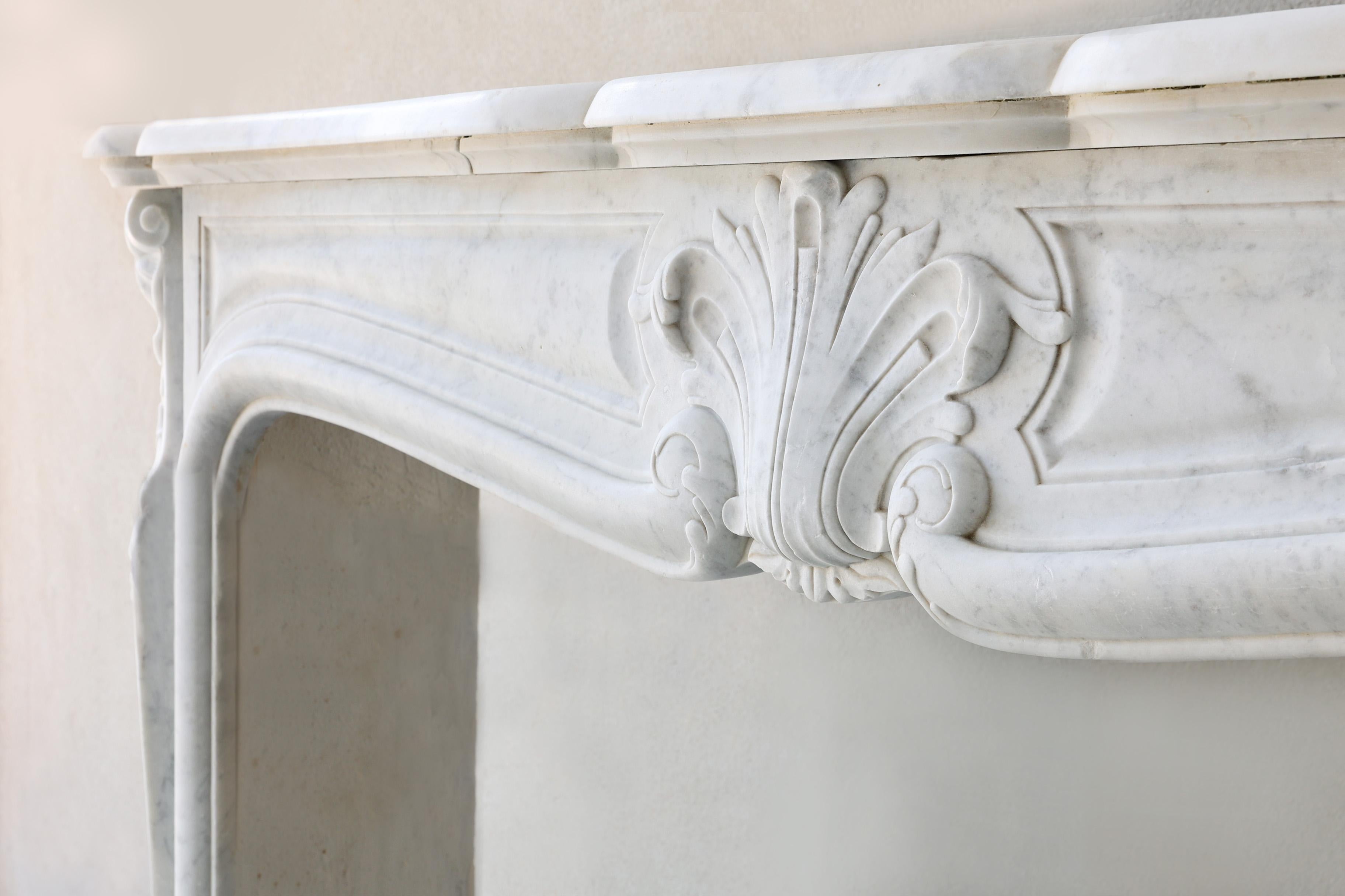 Marble Antique mantle surround of carrara marble in style of Louis XV, 19th century For Sale
