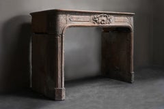 Antique mantle surround of French limestone from the 19th century