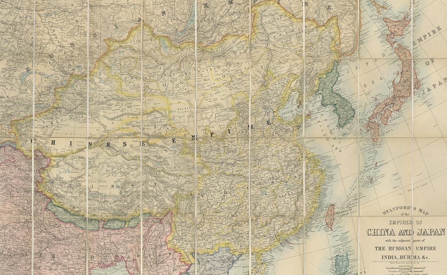 Antique map titled 'Stanford's Map of the Empires of China and Japan with the adjacent parts of the Russian Empire, India, Burma, &c.'. Large folding map of the Far East.