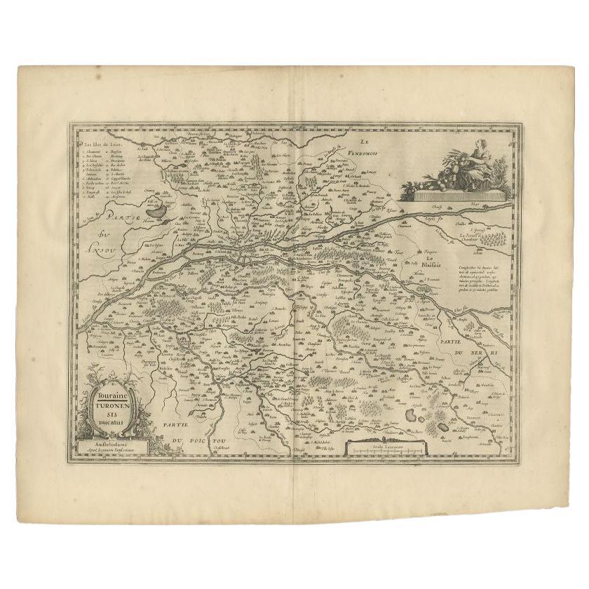 Antique map of France titled 'Touraine - Turonensis Ducatus'. Decorative map of the Touraine region. This map originates from 'Atlas Novus, Sive Theatrum Orbis Orbis Terrarum: In quo Galliae, Helvetiae (..)' by J. Janssonius (1656-1657). 
