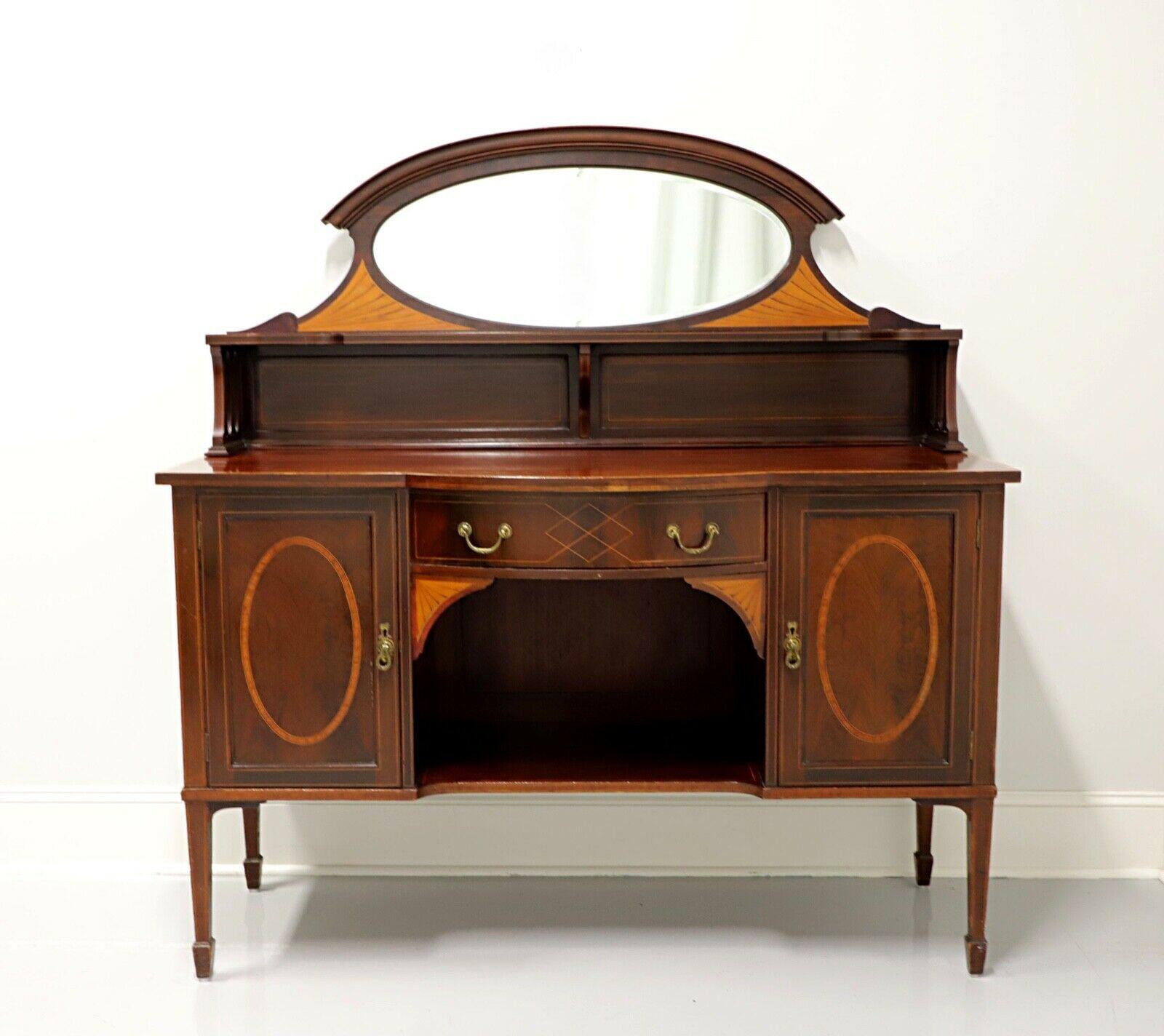 An antique 19th century Hepplewhite style sideboard by Maple & Company. Mahogany with inlaid satinwood & mahogany, brass hardware, upper gallery with mirror and spade feet. Features a raised upper gallery with center oval mirror, one center drawer