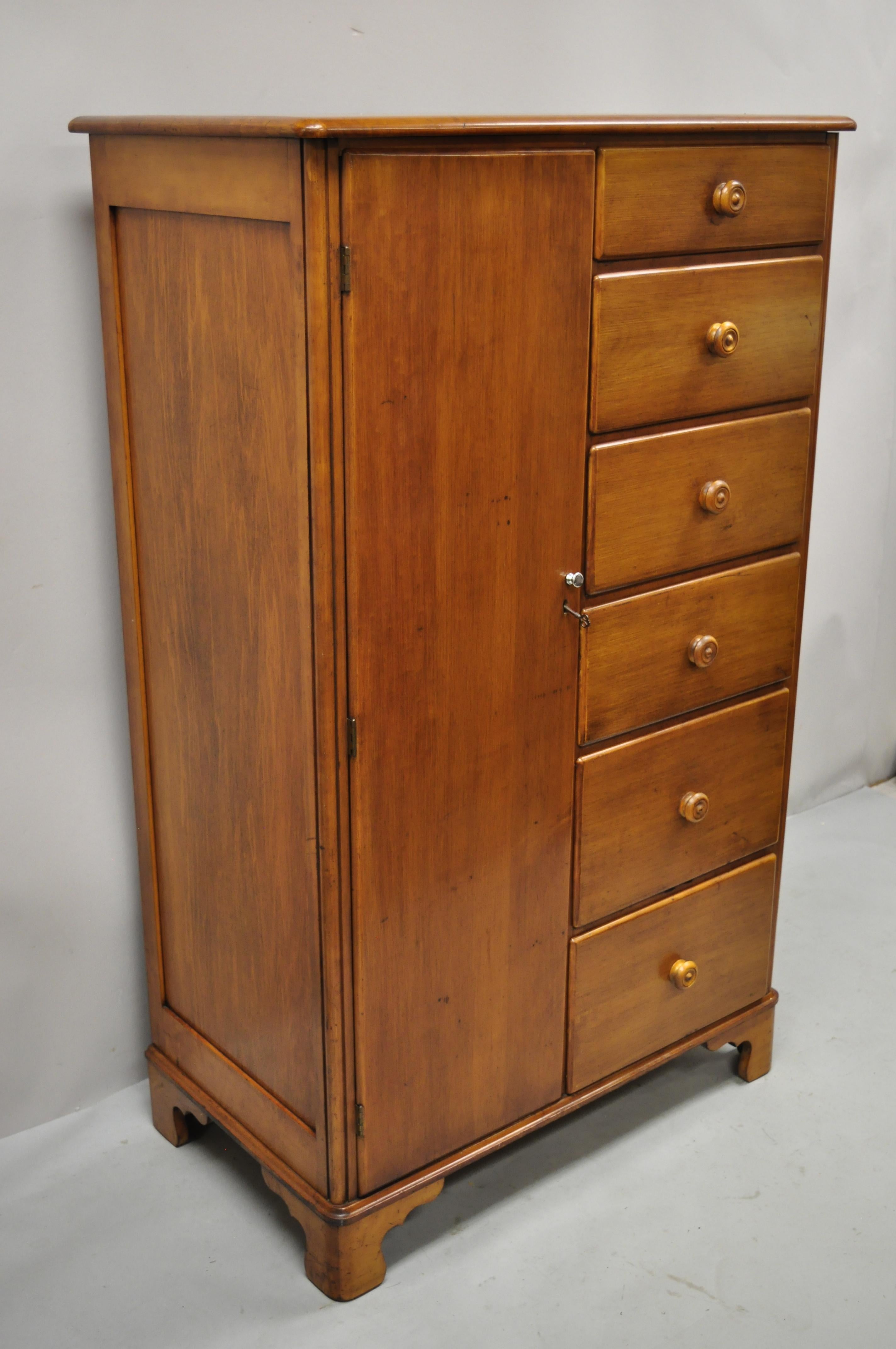 Antique maple wood colonial wardrobe tall chest dresser with 6 drawers and cedar lined cabinet. Item features cedar lined cabinet, solid wood construction, beautiful wood grain, 1 swing door, 6 dovetailed drawers, very nice antique item, great style