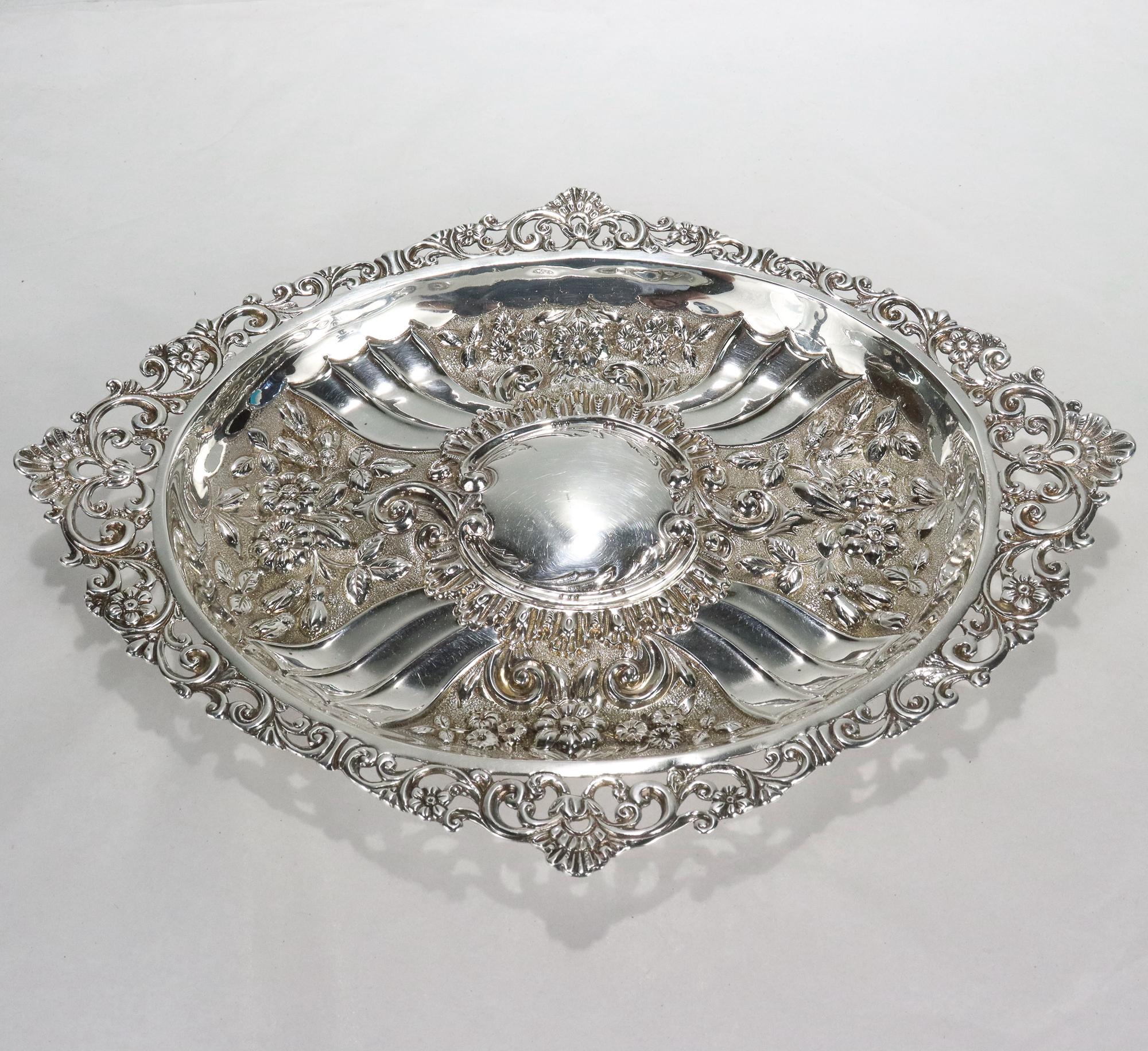 A fine antique English sterling silver dresser tray. 

Made by Charles Engelhard for Mappin & Webb.

Struck CE for Charles Engelhard, Lion's heart, Lion rampant, C for 1898.

Simply a great ornate sterling silver tray!

Date:
1898

Overall