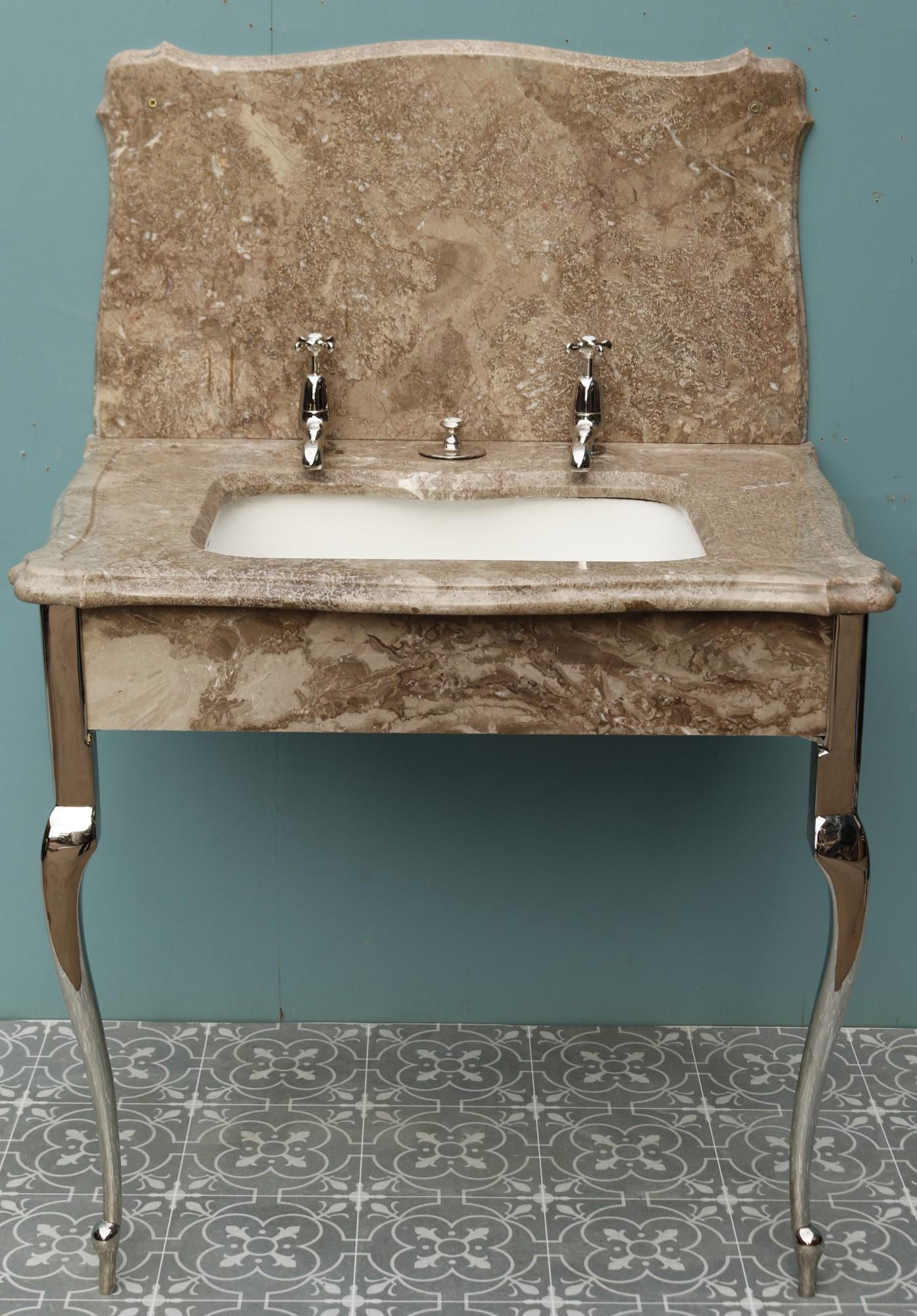 A pretty mottled brown marble wash stand with undermounted plunger basin. Most likely by Shanks or Bolding. With nickel plated legs, taps and plunger waste.
 
Supplied in fully restored condition.
 
Additional Dimensions
 
Overall Height 121 cm
