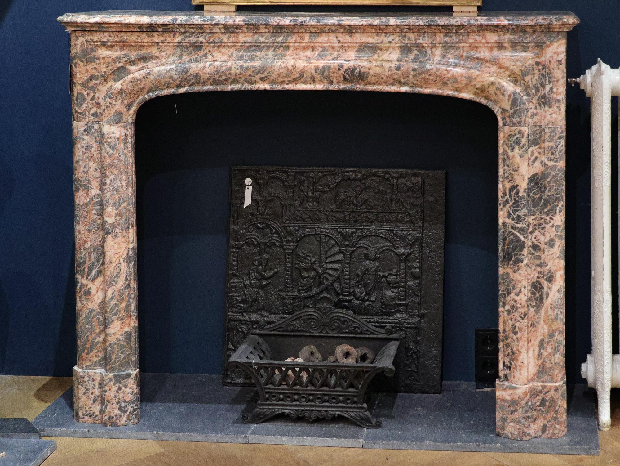 Enrich your living space with our antique marble Boudin fireplace. This 19th Century French mantelpiece boasts a simple yet captivating design, showcasing a beautiful interplay of pink marble with subtle gray undertones.

Dimensions:

Height: 109