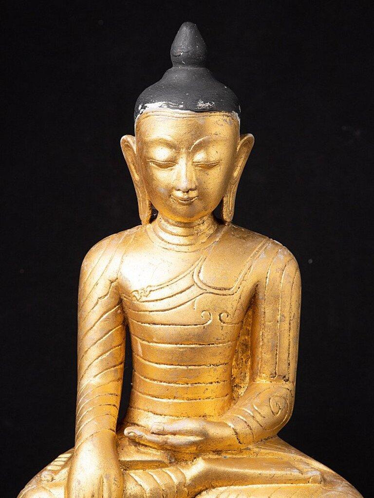 Material: marble
52 cm high 
30,5 cm wide and 14,8 cm deep
Weight: 20.1 kgs
Gilded with 24 krt. gold
Ava style
Bhumisparsha mudra
Originating from Burma
18th century
The Buddha seems to be re-gilded in the 20th century.
 