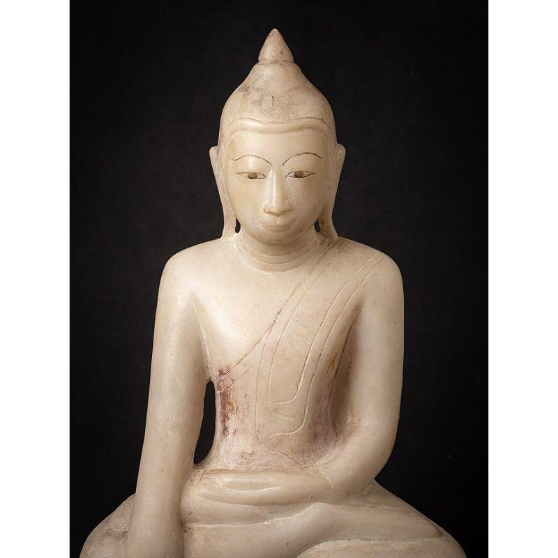 Material: marble
50,5 cm high 
32,2 cm wide and 18,2 cm deep
Weight: 16.35 kgs
Shan (Tai Yai) style
Bhumisparsha mudra
Originating from Burma
17th century.

