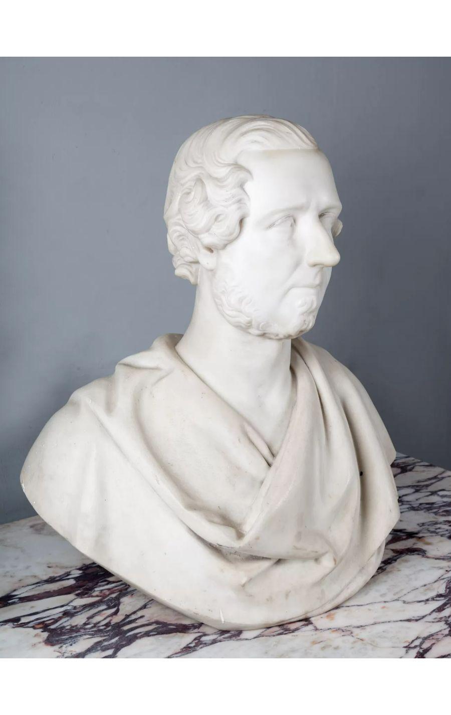 An antique marble bust of a bearded male in classical Roman attire.

Larger than life size and carved in pure white Italian statuary Carrara marble.

In un-restored original country house condition. Can be cleaned if required.

Circa