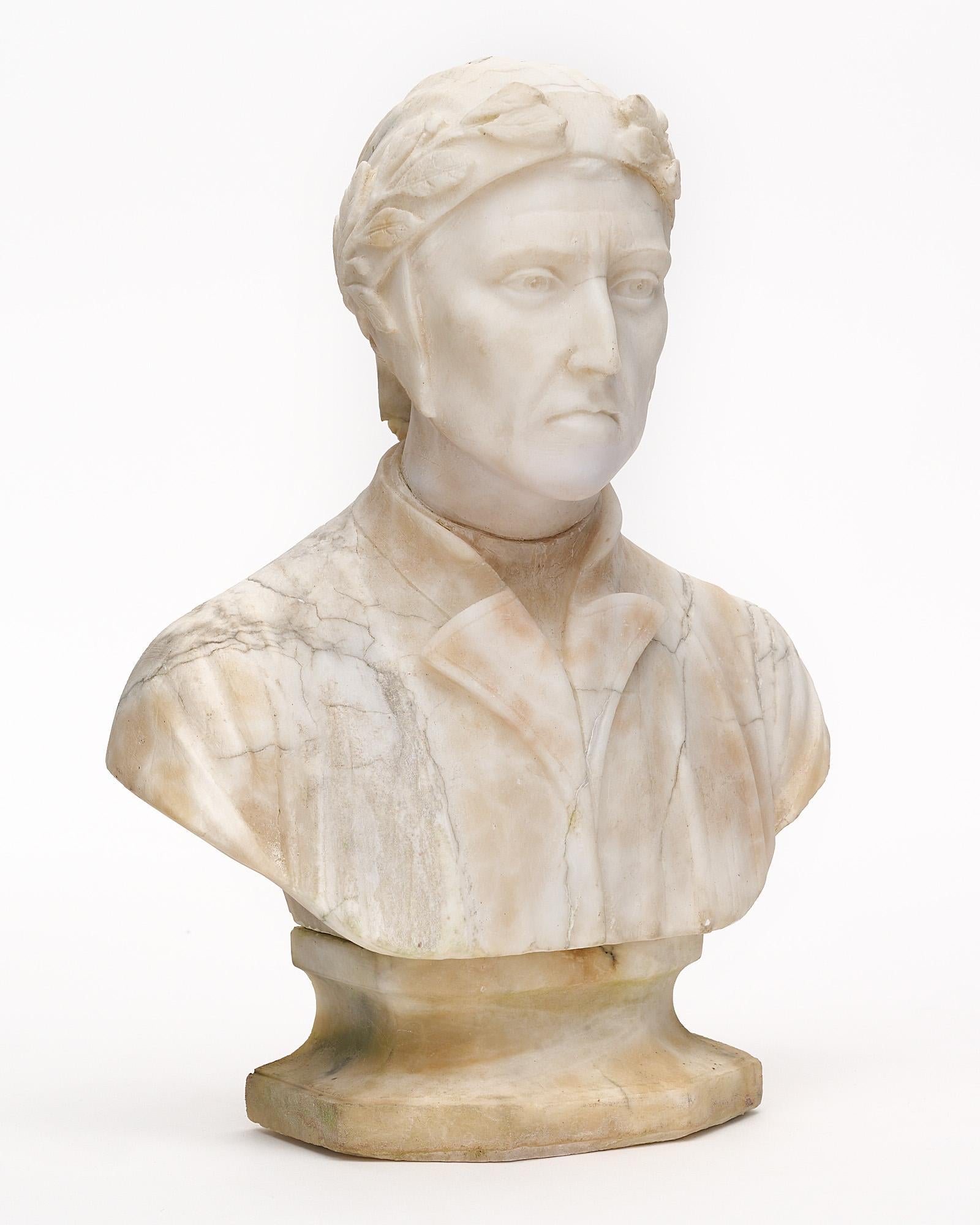 Bust of Dante Alighieri from France made of Carrara marble. This hand-carved sculpture portrays a lifelike Dante, the famous Florentine writer often described as the father of the Italian language. He is shown in a classic pose with a stoic