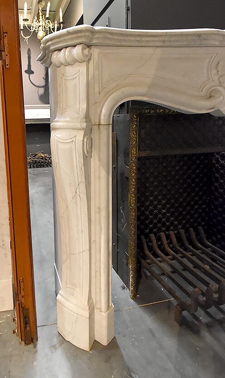 Very beautiful antique marble fireplace mantel from the 19th century.
Recuperated from Paris, France and it is a Louis XV model.
This fireplace should be placed in front of the chimney.
  
