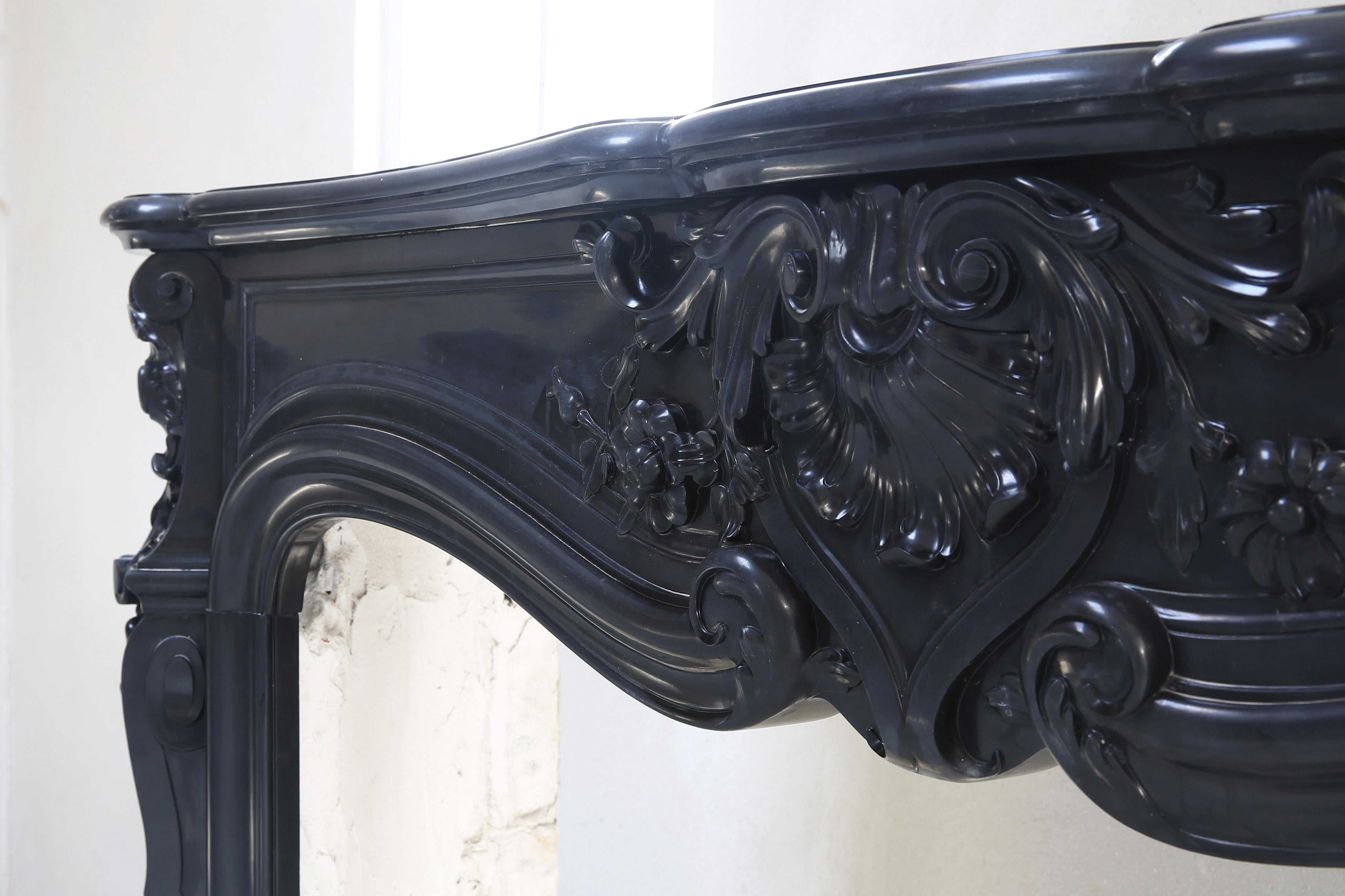 A beautiful 'Noir de Mazy' fireplace. Noir de Mazy is black marble and comes from Belgium. This type of marble is becoming increasingly rare, because the quarries in Belgium are almost closed. This mantelpiece dates from the 19th century and is in