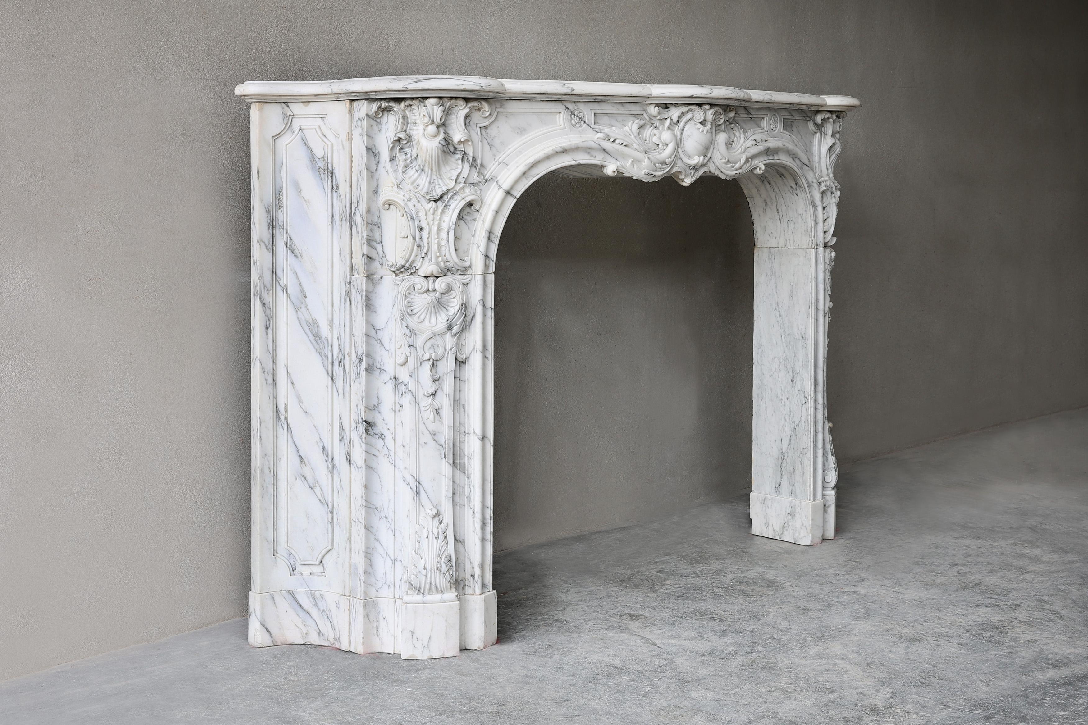 Exceptional, impressive and monumental 19th century antique fireplace surround in beautiful Arabescato marble. 
The carving is in superb quality showing the high standard and exceptional craftsmanship of its sculpturer. This unique antique
