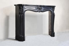antique marble fireplace of Noir de Mazy marble in style of Louis XV 19 cent