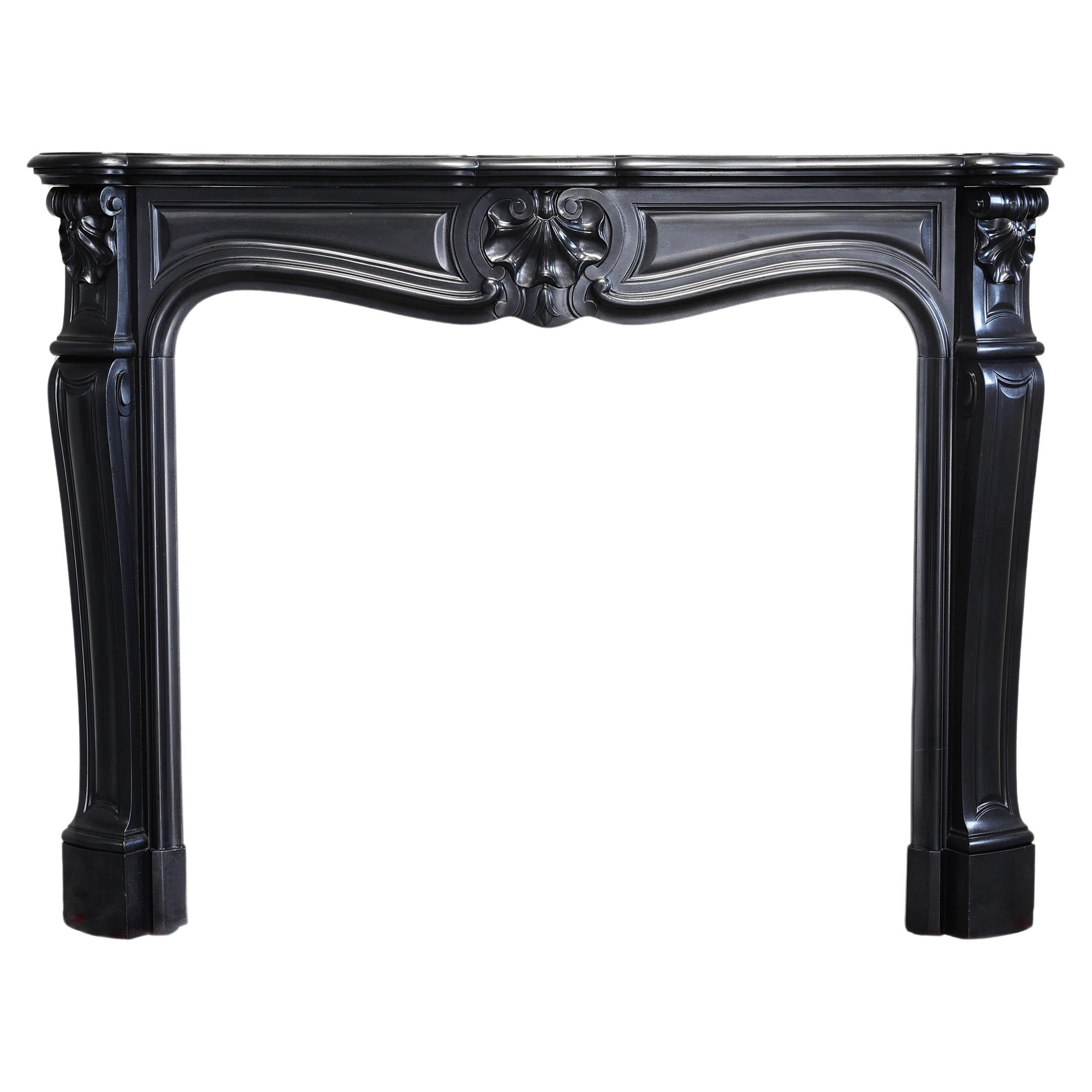 antique marble fireplace of Noir de Mazy marble in style of Louis XV 19 cent For Sale