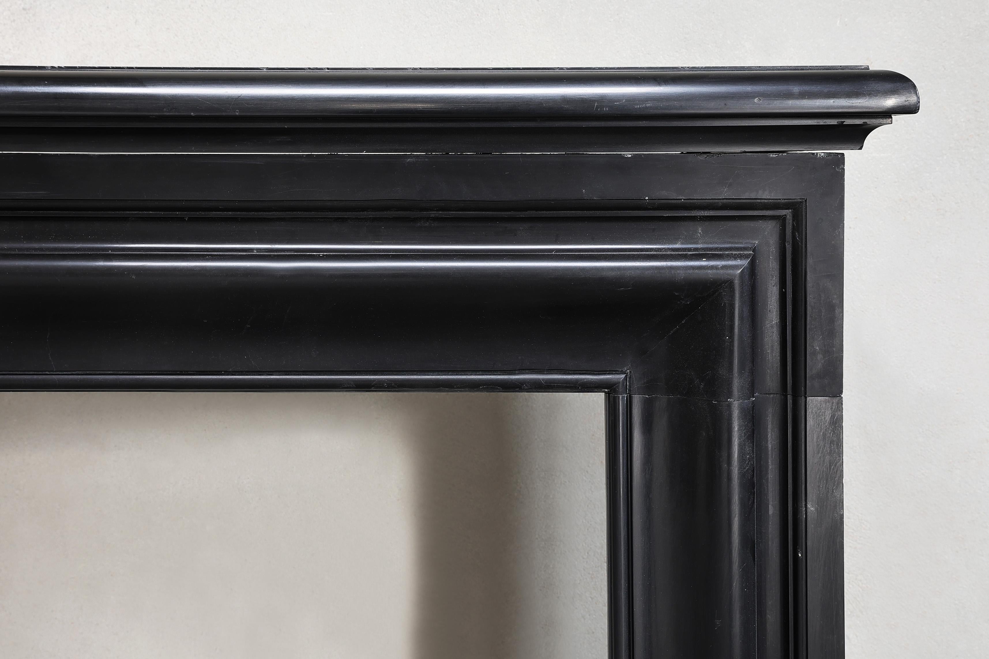 Other antique marble fireplace of Noir de Mazy marble in style of Louis XVI For Sale