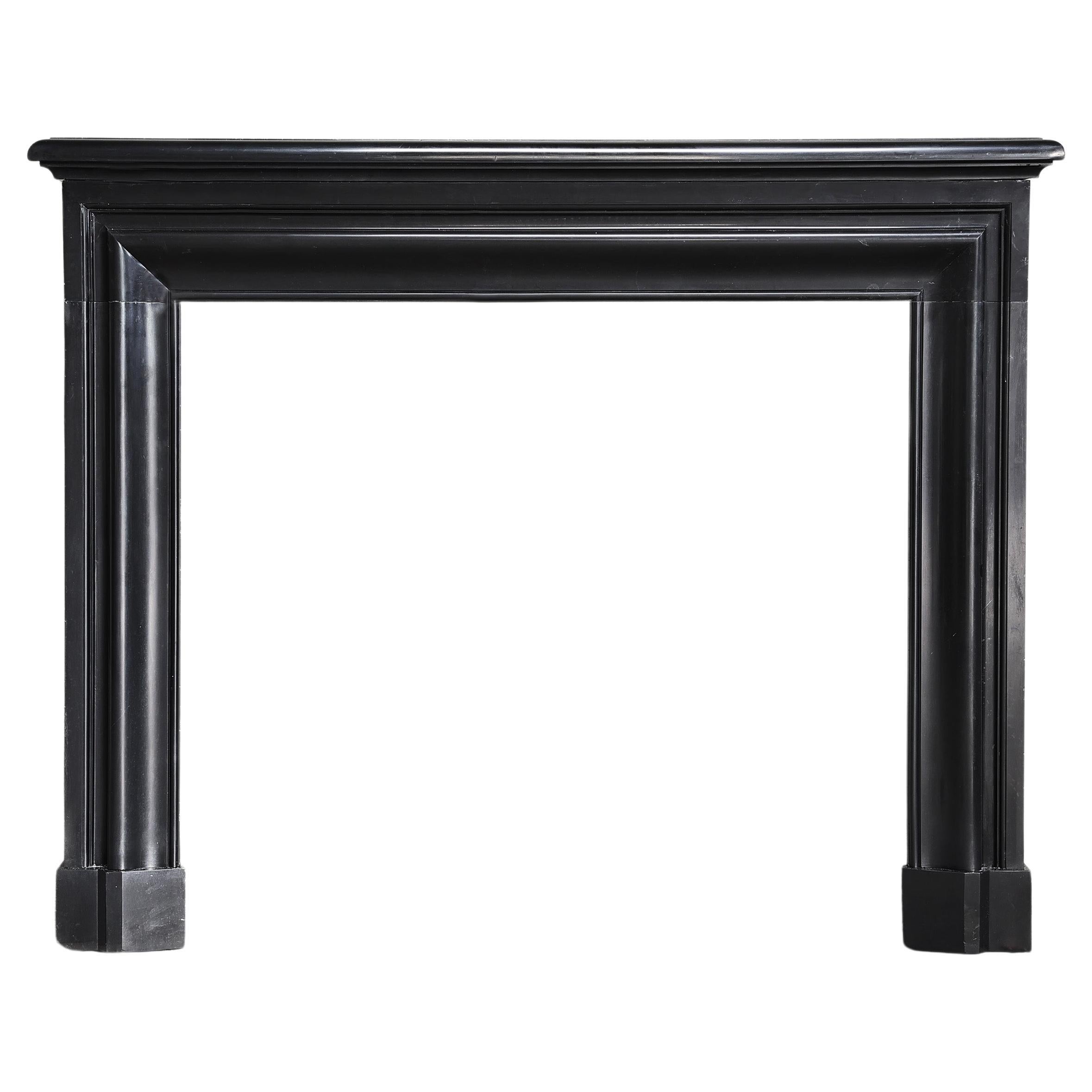 antique marble fireplace of Noir de Mazy marble in style of Louis XVI For Sale