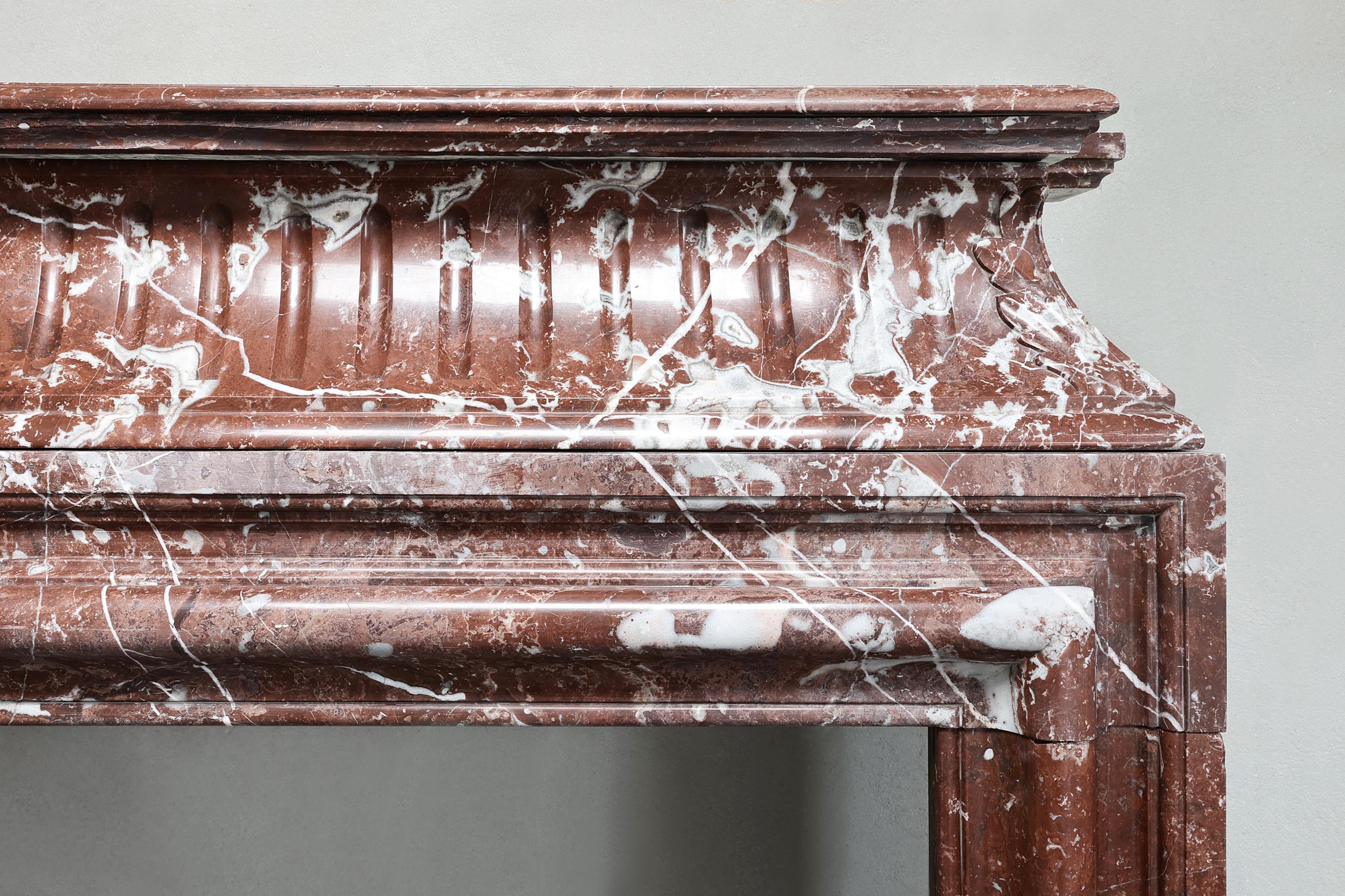 French antique marble fireplace of Rouge Royal in the style of Louis XVI  For Sale
