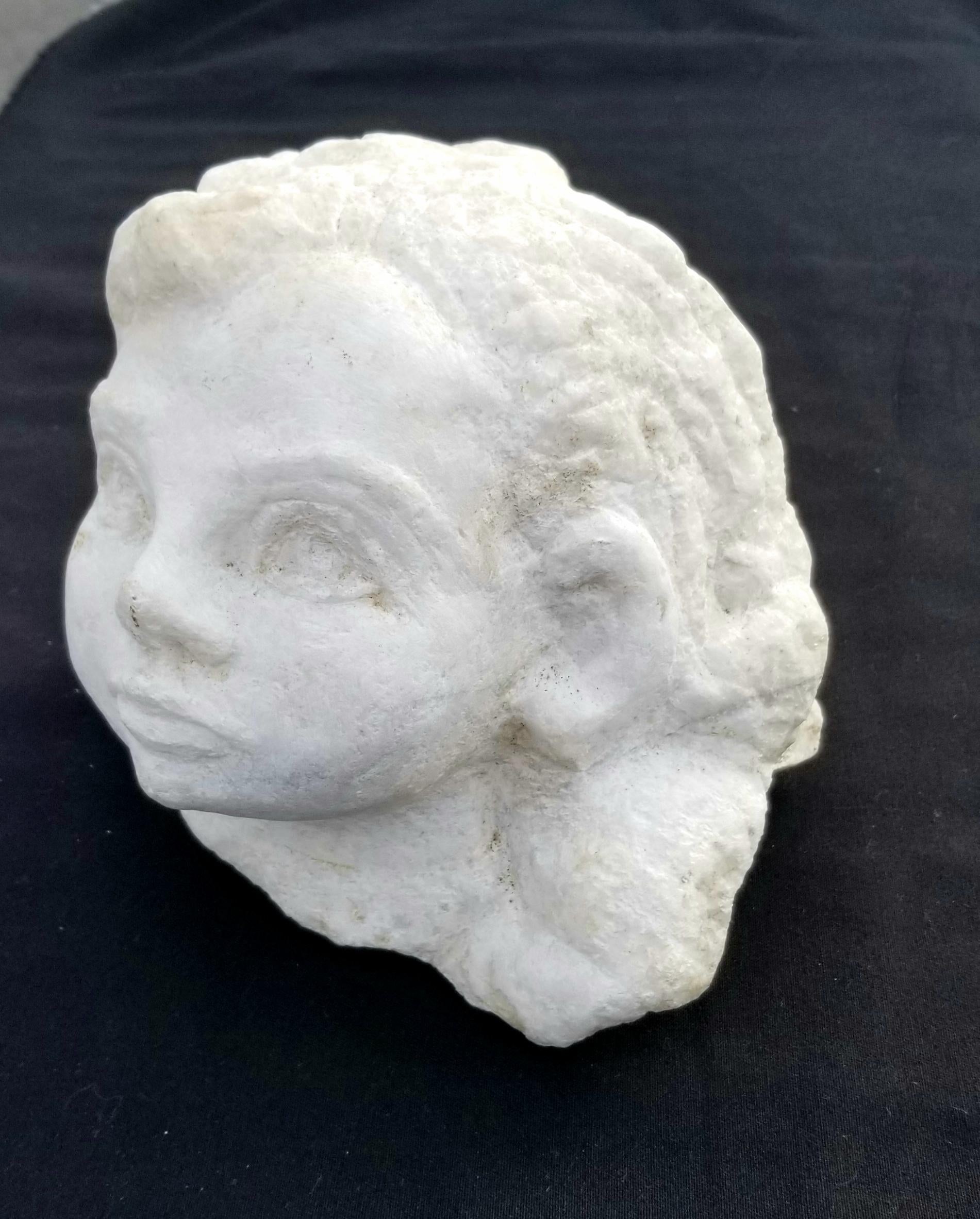 Italian head sculpture of the child. Hand chiselled free standing on the 19th century stone column.
Dimension without column:
H 7 inches, W 8 inches, D 7 inches.

     