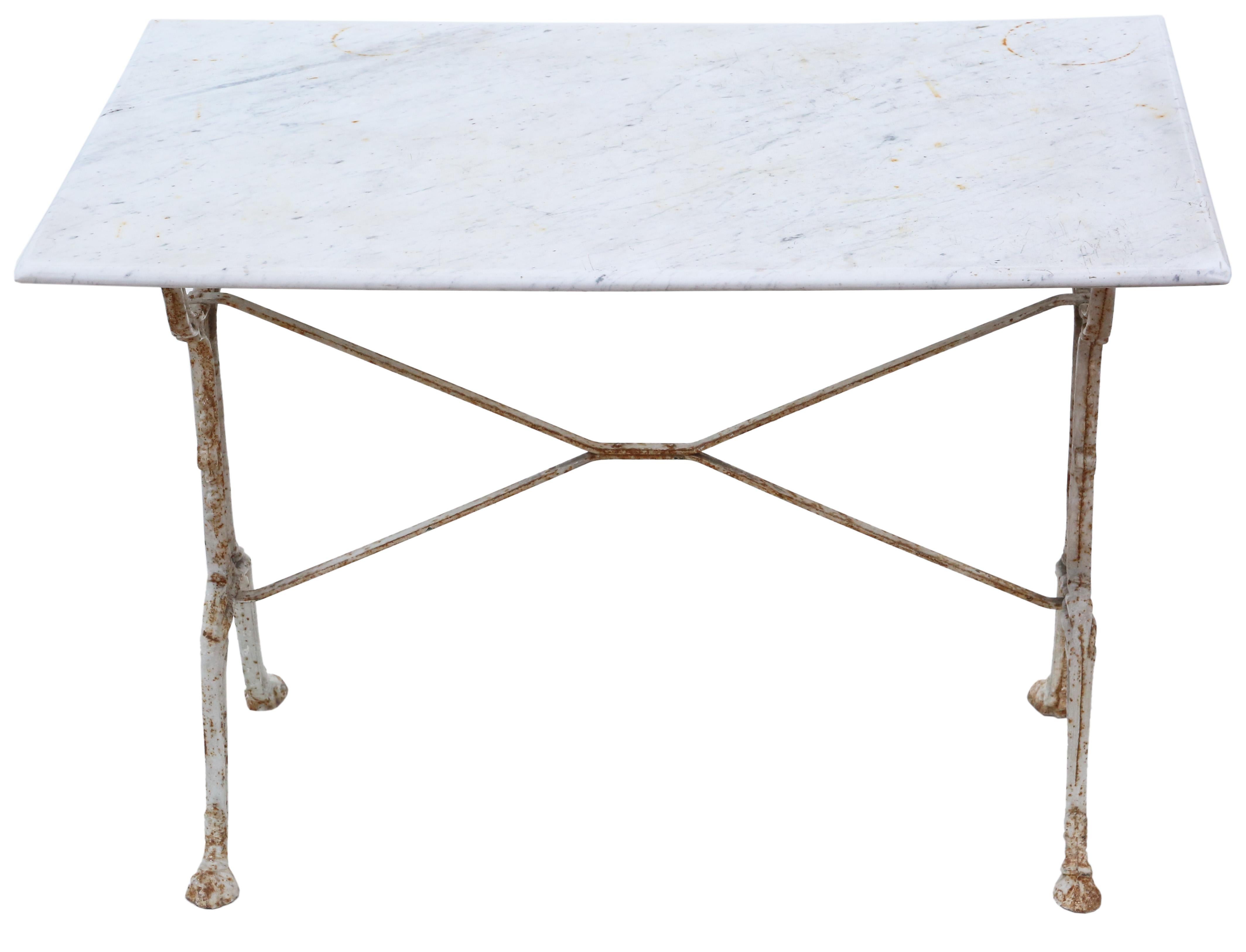 Presenting an exquisite 19th Century patisserie bistro kitchen garden dining table, adorned with the timeless elegance of marble and cast iron. This antique gem features a distressed white-painted base, showcasing the charming allure of age, while