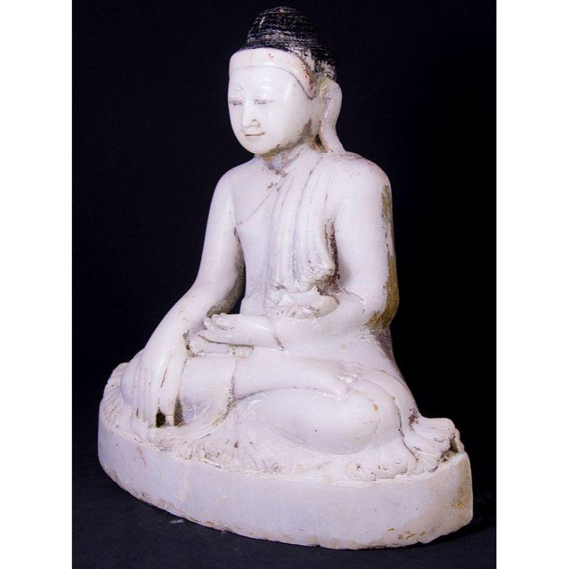 Material: marble
50 cm high 
44 cm wide and 24 cm deep
Weight: 37.4 kgs
Mandalay style
Bhumisparsha mudra
Originating from Burma
19th century

