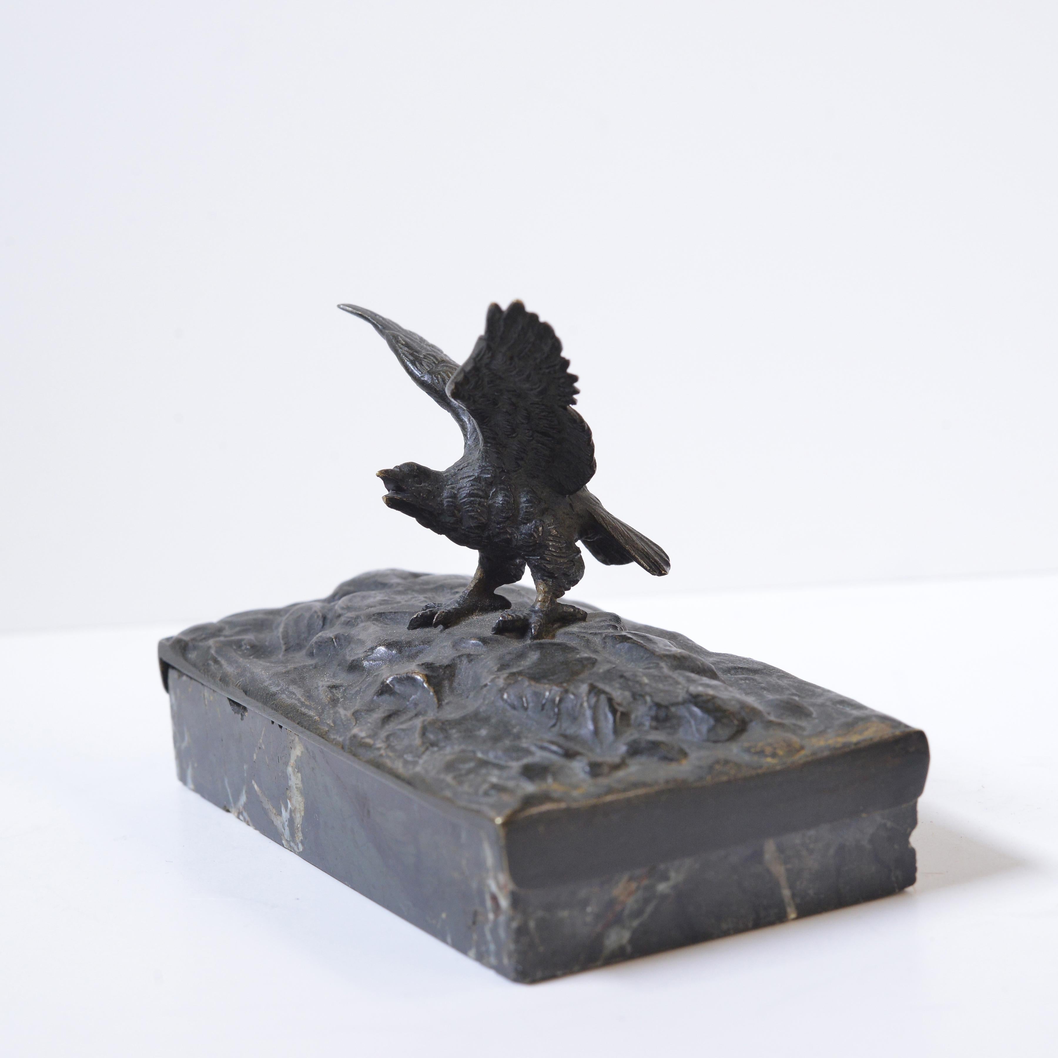 Late 19th century nice quality bronze and dark green marble work. The finely detailed plumage of the bird with its fierce gaze demonstrates the handiwork of the craftsman. In a world full of mass-produced goods, it is these exclusive pieces that