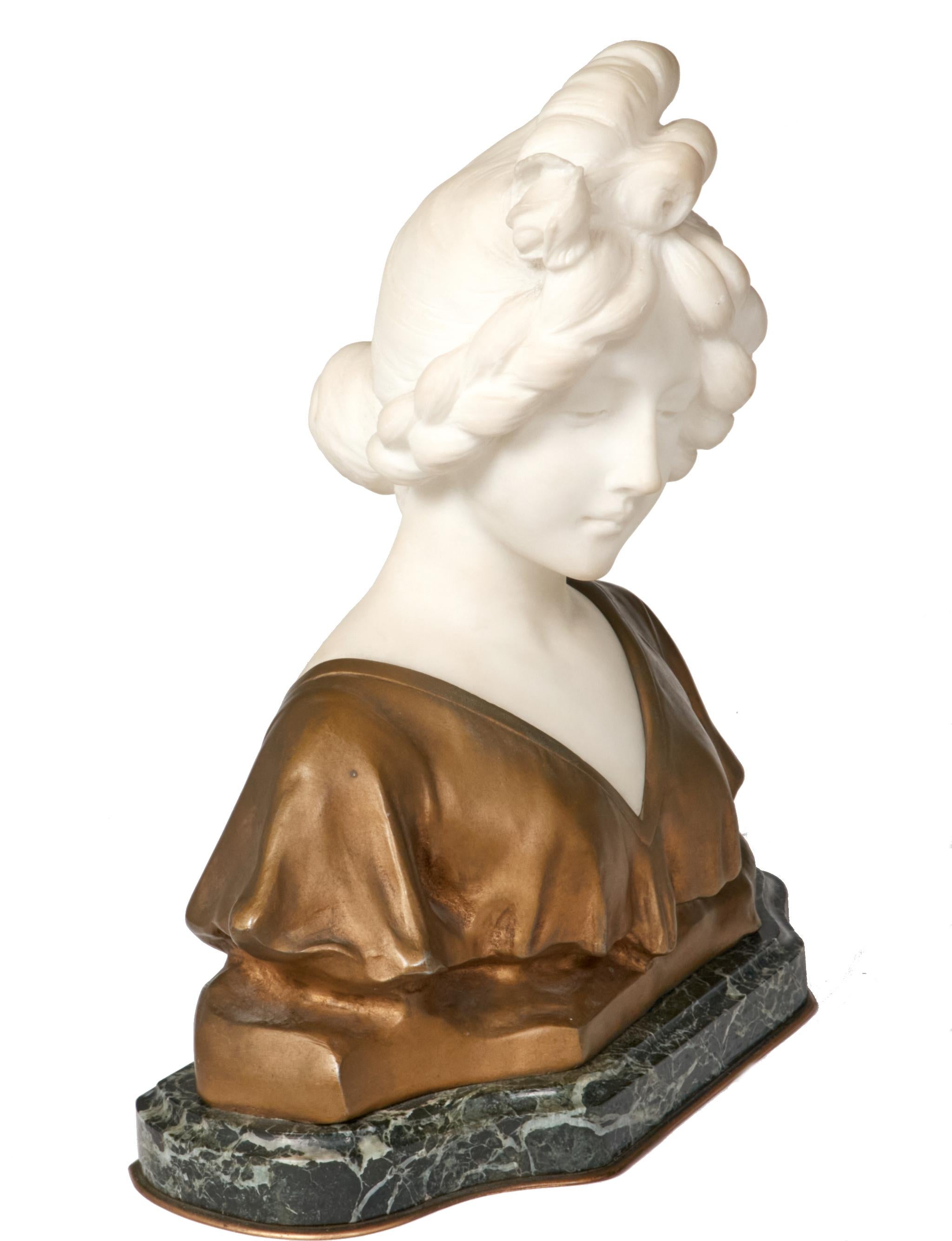 Graceful marble and bronze bust of a demure young woman by listed French/Italian artist Affortunato Gory (1895-1925). Beautifully rendered bust in marble with her hair pulled back and wearing a draped gown sculpted from bronze. Presented on a dark