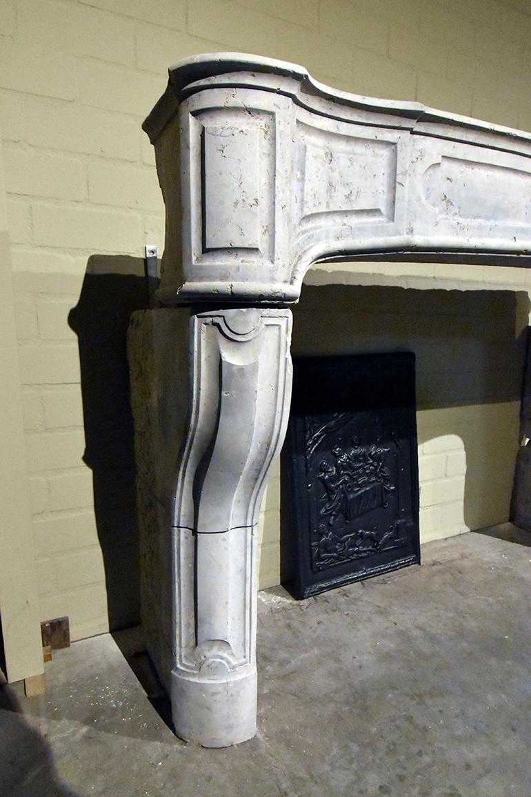 Very beautiful antique marble stone fireplace mantel 
from the 18th century.

To place in front of the chimney. Recuperated from
a mansion in France near Paris.