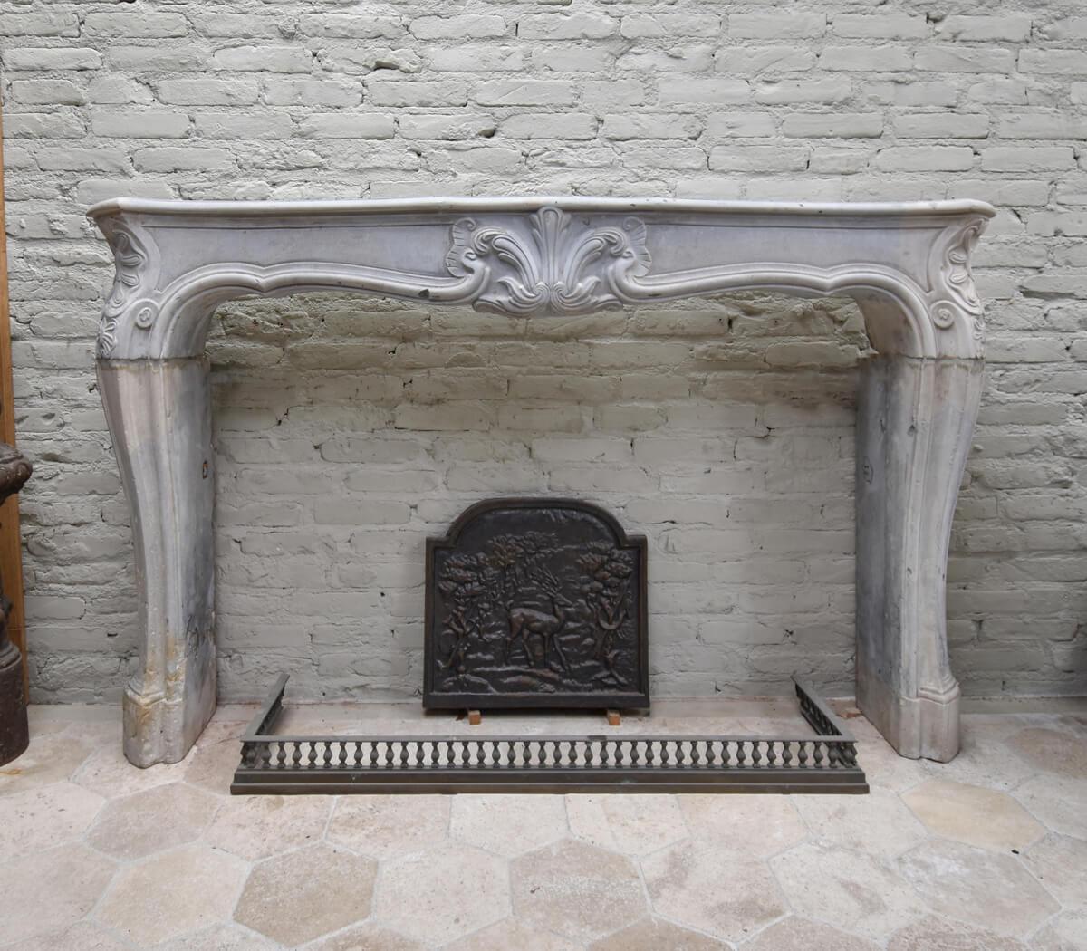 Beautiful unique and antique Louis XV front fireplace mantel 
from the 19th Century. Made out of marble stone.