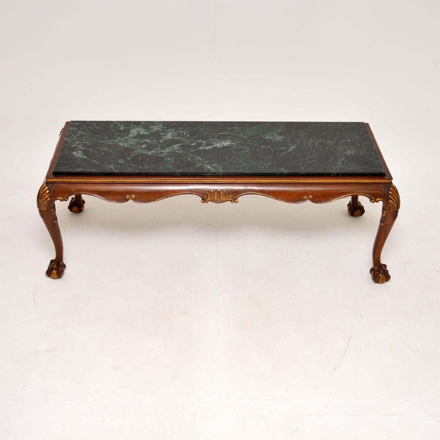 A fantastic antique marble top coffee table in the Chippendale style. This was made in England, it dates from around the 1920-30’s.

It is of superb quality, the frame is beautifully designed with shell carving at the knees, claw and ball feet, and