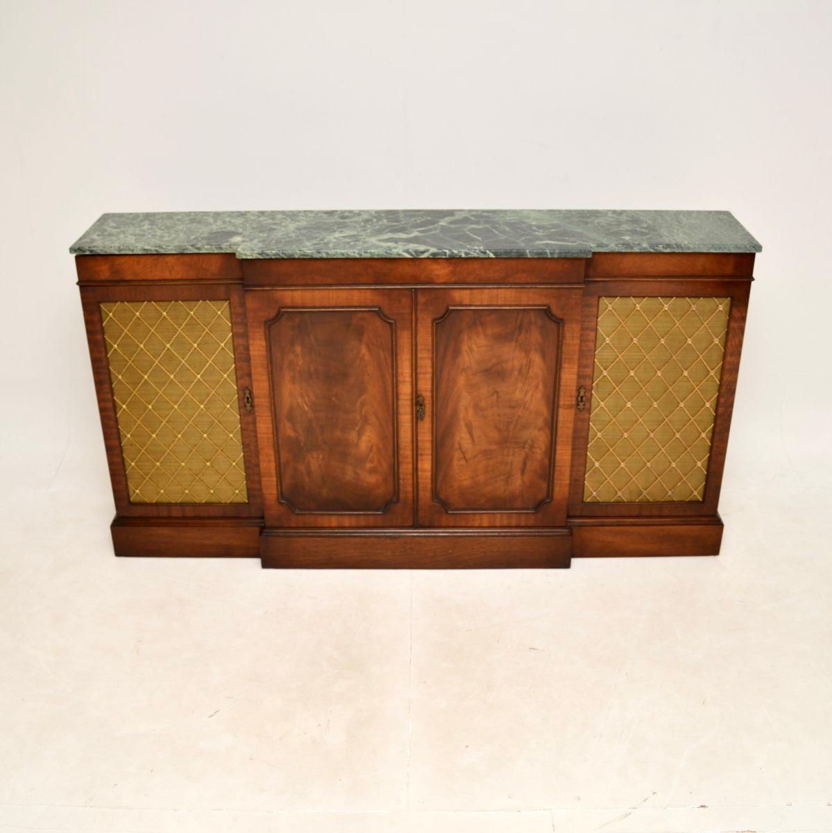 An impressive and very well made antique marble top grill front sideboard in the classic Georgian style. This was made in England, it dates from around the 1930’s.

The quality is outstanding, this is beautifully designed and is a very useful piece