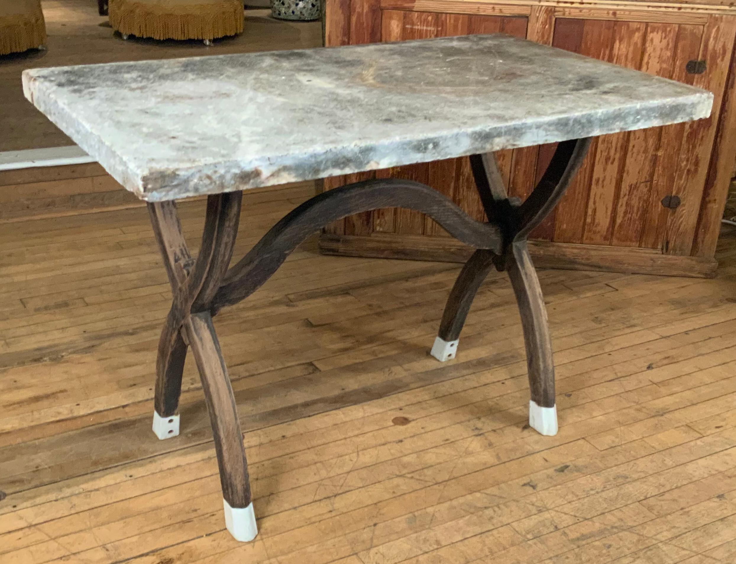 American Antique Marble Top Table with Curved X Base and Enamel Feet