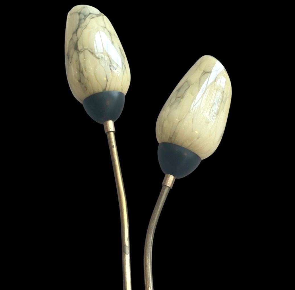 Art Deco 1960's Brass Wall lights, featuring marbled glass cream shades.

Also Available in White A Finish.

The glass shades are cut slanted giving a 'lily flower' resemblance.
Arms & glass shades can be turned to suit your preference.

8cm
