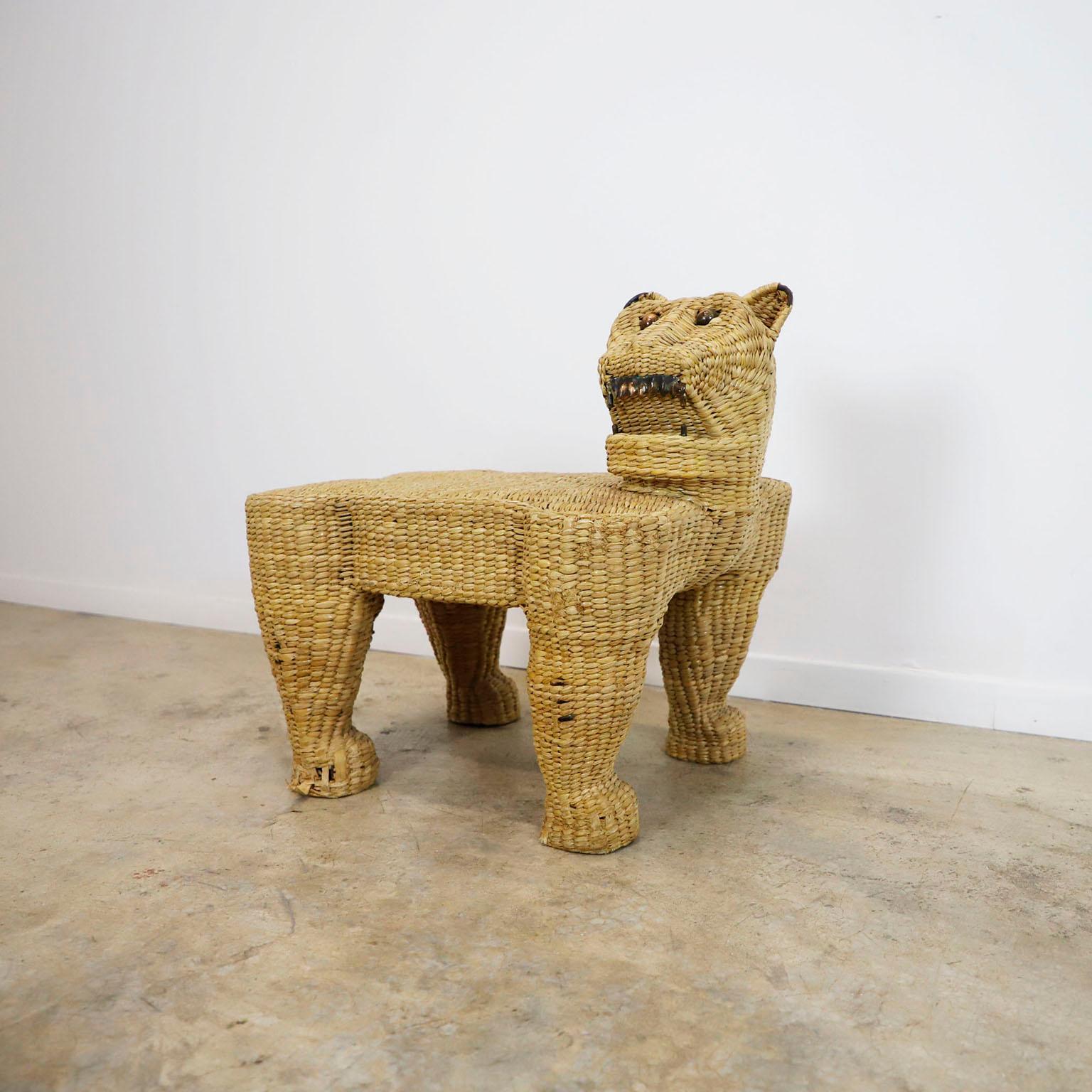 Circa 1970, we offer this Antique Mario Lopez Torres Jaguar Stool, made in natural woven and iron structure, the eyes are made in brass. It has details on one ear and on the legs.