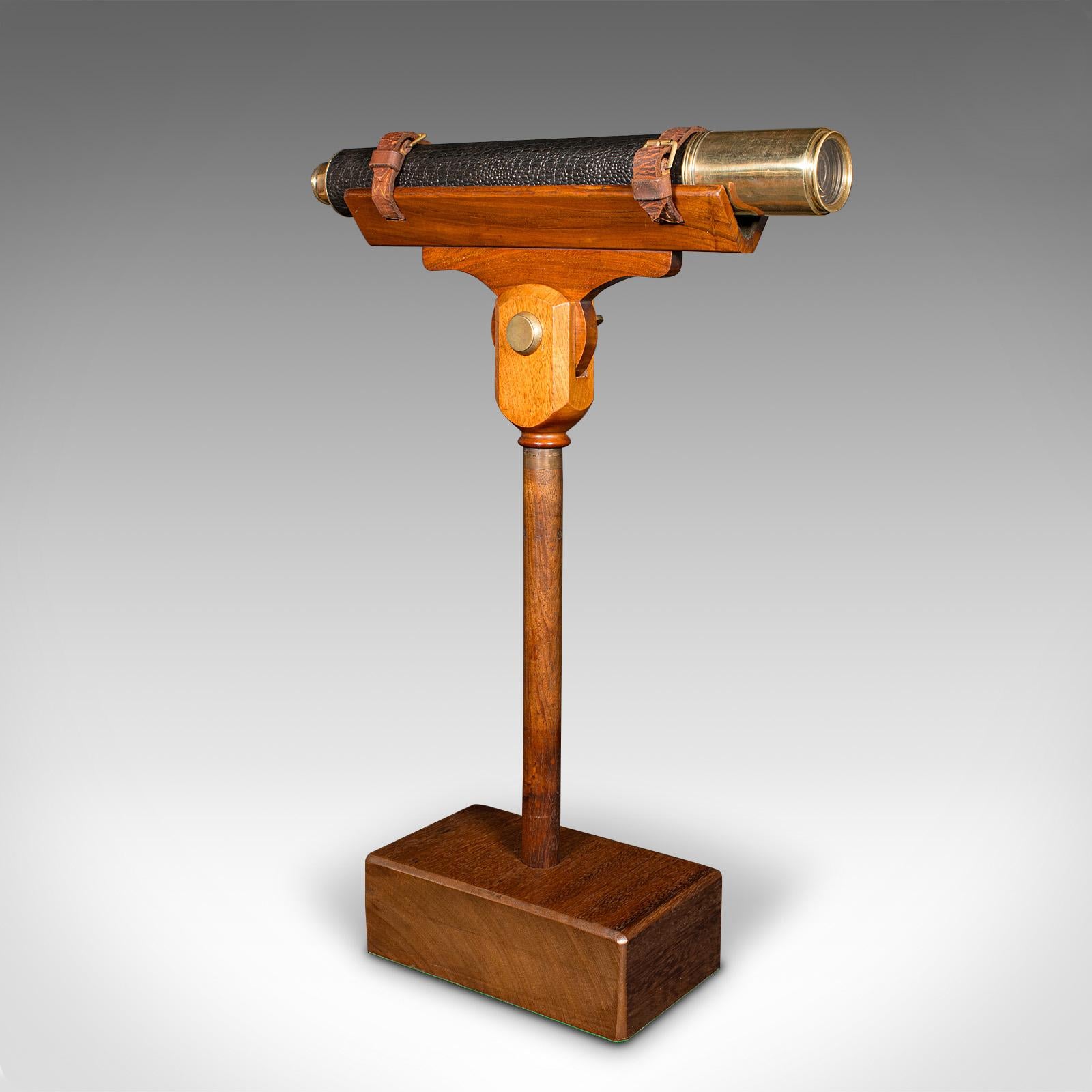 This is an antique maritime telescope. An English, brass and walnut mounted ship's instrument by J. Sewill, dating to the Victorian period, circa 1870.

Perfect for bird watching, landscape appreciation, wildlife stalking, or maritime observation.