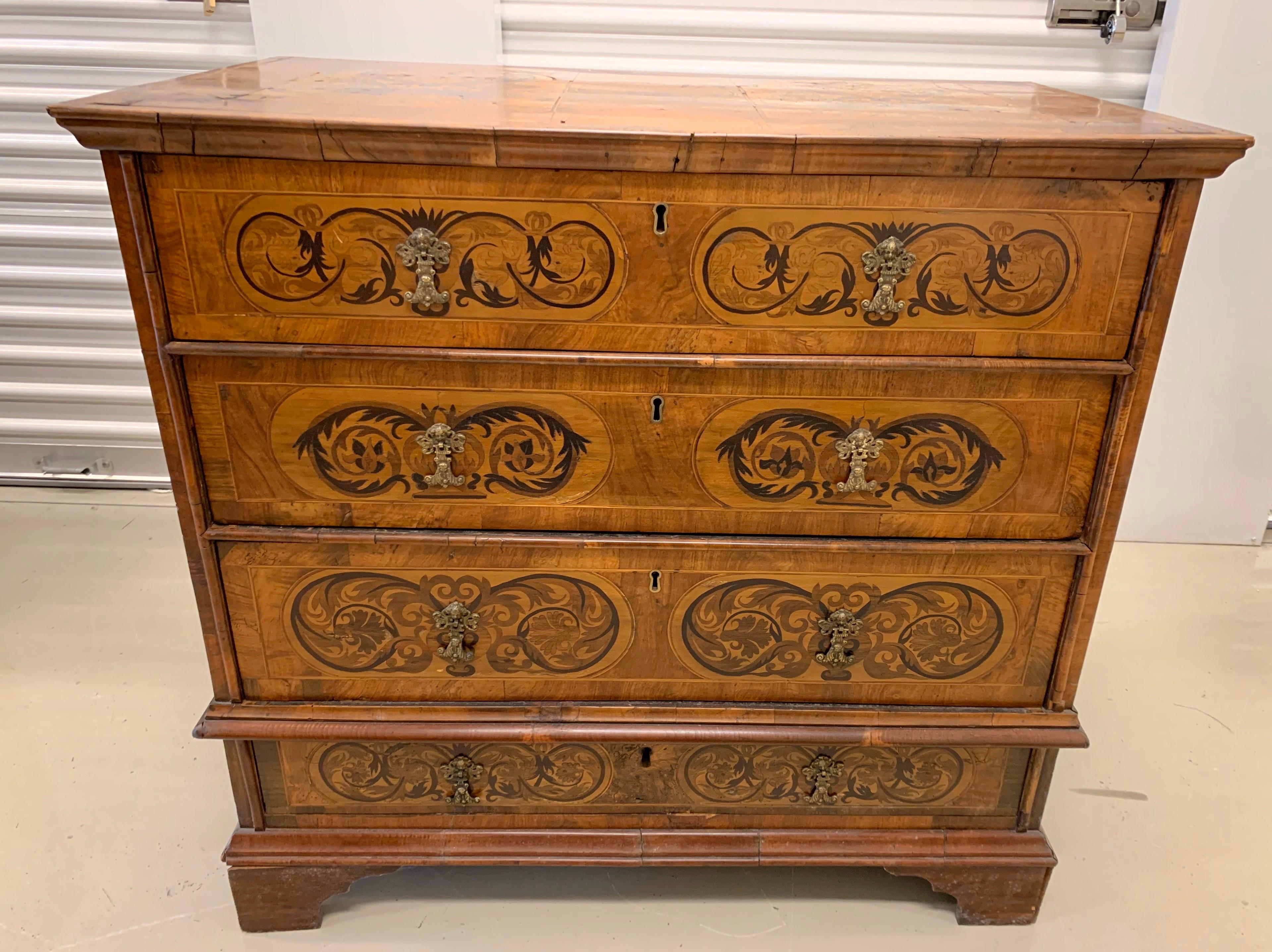 Rare antique marquetry chest of drawers circa early 19th century. There are some losses as would be expected from a piece of this age. We have taken several photographs to show losses. That said, the piece is exquisite.