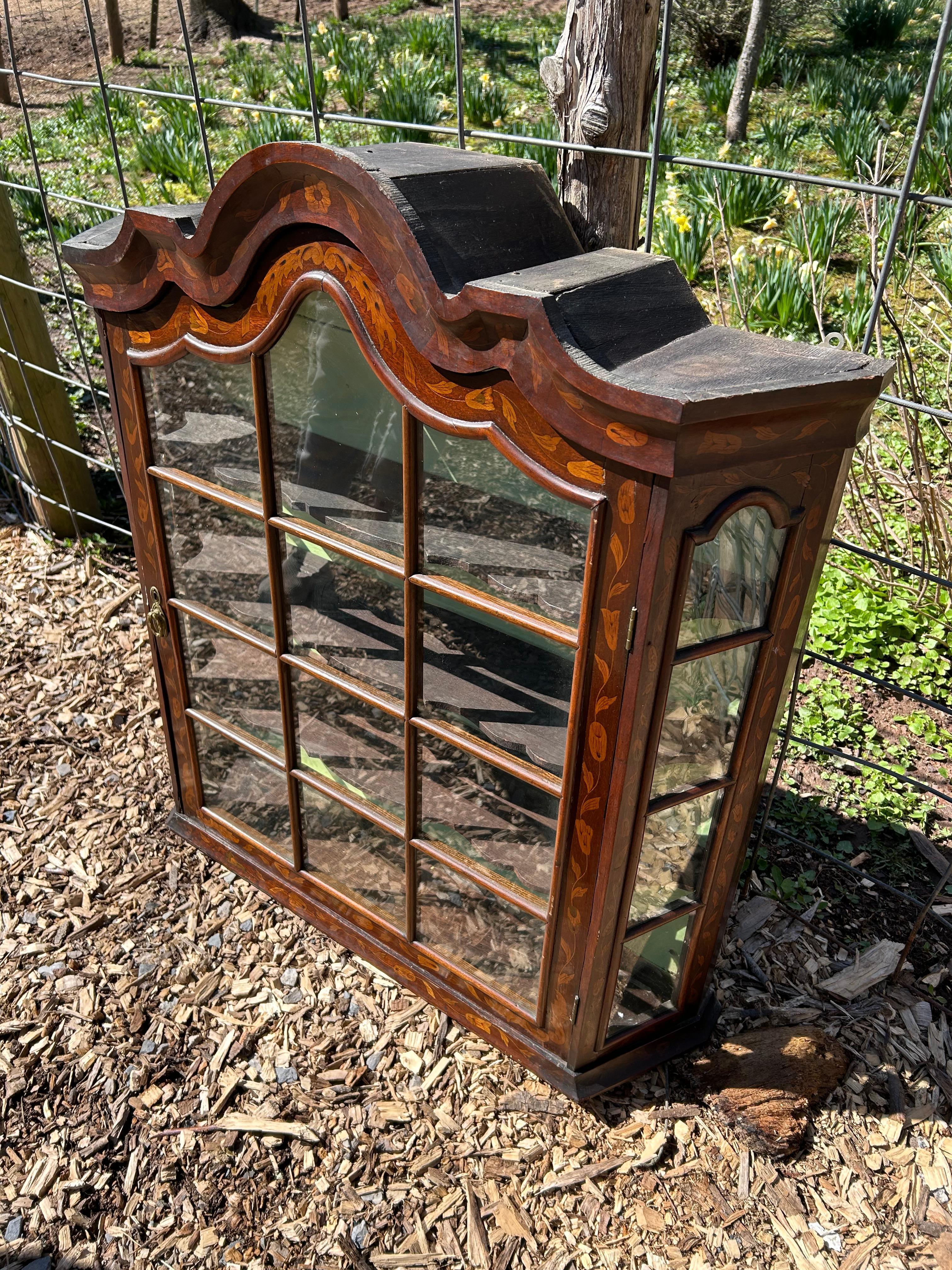 Lovely antique marquetry inlaid wall curio cabinet having interior shelves.
8.5” to bottom shelf from bottom; 6” to next shelf,  6.5 to next and 11 at top.
32.5” w at back of shelf
