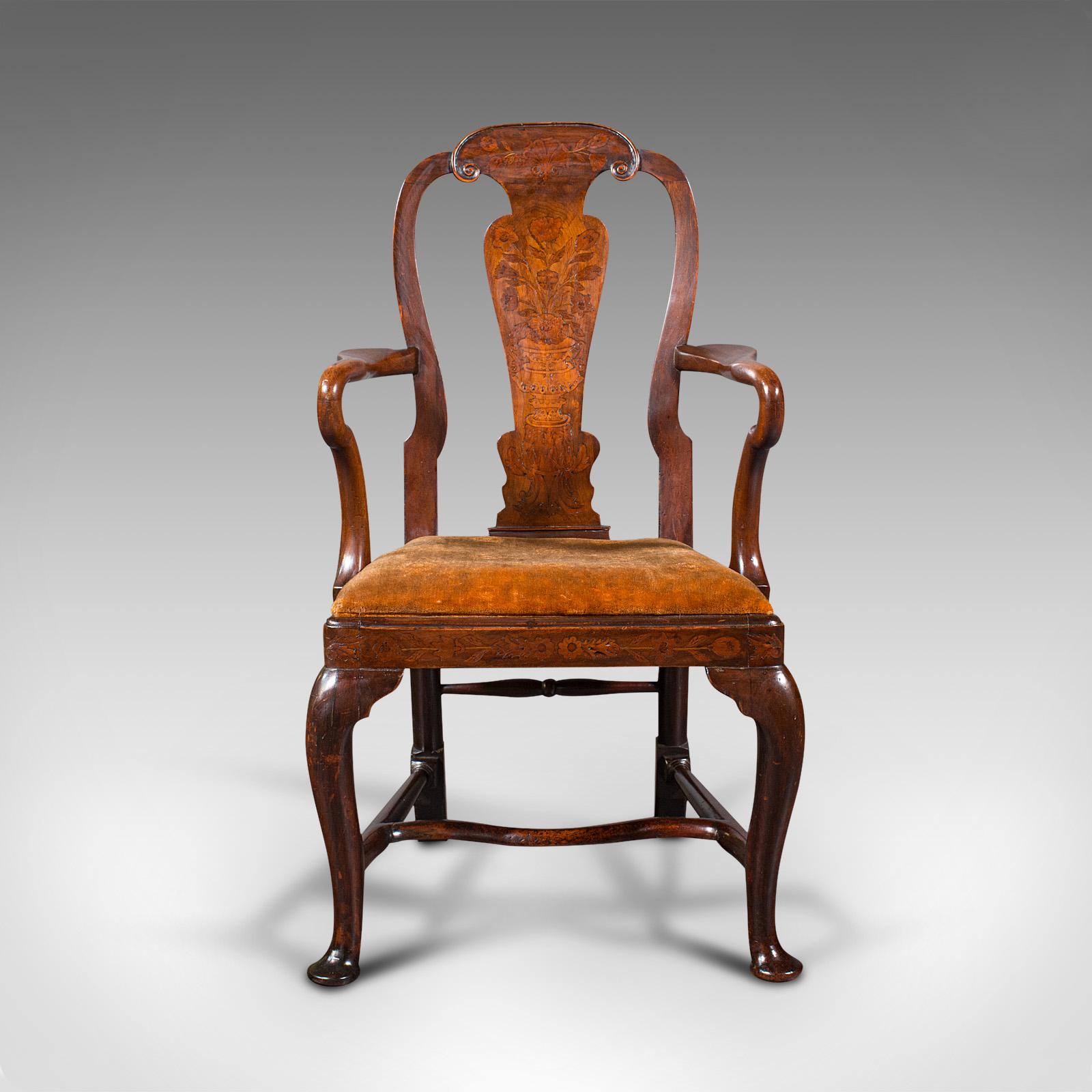 This is an antique marquetry elbow chair. A Dutch, beech and fruitwood carver, dating to the Georgian period, circa 1800.

Embodies the sinuous, inlaid splendour of late 18th century Dutch craftsmanship
Displaying a desirable aged patina and in